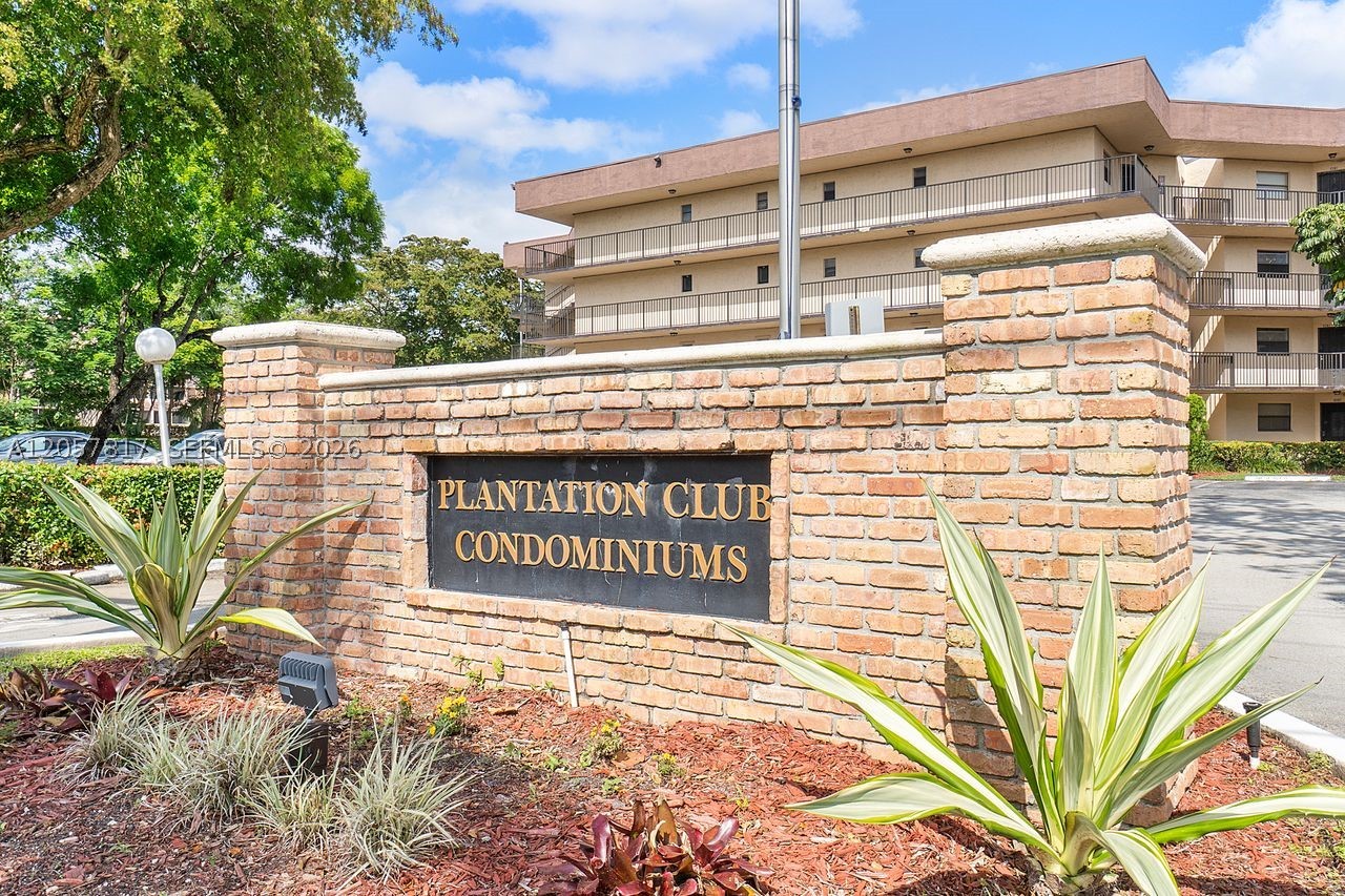 RARE opportunity to Own a Spacious Condo IN the Heart of Plantation! This Spacious Corner Home features, a Screened Lanai great for lounging and enjoying Florida's weather, amazing Ceramic Floors, Tons of Storage, Closet Space, and in unit Washer & Dryer. The Primary Bedroom has Ensuite Bathroom. The Plantation Club Condo Community amenities include a Pool, Hot Tub, Game-Room, Gym, Sauna, Bike Storage, Clubhouse, Elevator. Not to mention, the community is location a short distance from shopping, dining and entertainment! Move in Ready! Large Freezer does not convey