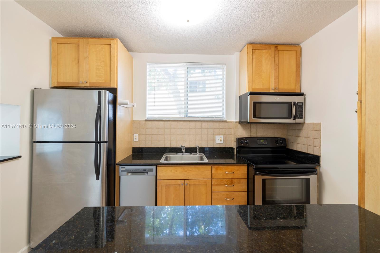 Updated 2-bedroom 1-bath with laundry in the unit and parking in a quiet area of Little Havana. At almost 1,000 sqft this is very large unit with ample space.  The spacious living room gives more than enough room for a great size sitting area and separate dining.  The kitchen features granite counters and tons of storage.  Bedrooms are also a great size with plenty of closet space.  Unit also has central air conditioning which is a big plus and is rare for Little Havana. The unit comes with one parking space and plenty of street parking.  The location is perfect, being situated just a couple blocks from Calle 8 and minutes from Brickell, downtown, Midtown, Wynwood, the health district, Coconut Grove, Coral Gables and the airport. FAST APPROVAL. Call listing agent today for an appointment.