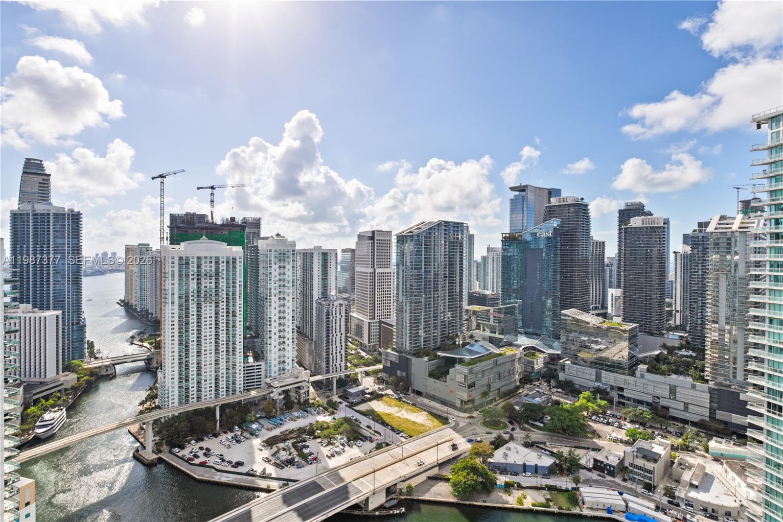 Experience 43rd-floor living at The Ivy, a gated community on the Miami River steps from Brickell City Centre. This renovated 2-bed, 2-bath residence offers panoramic skyline and river views, a bright southern exposure, and a split floor plan ideal for privacy or a dedicated workspace. Recent updates include new flooring, upgraded finishes, and a glass-enclosed jacuzzi in the primary suite—an uncommon feature in this price range. The home features impact windows, a spacious balcony, and a move-in-ready interior designed for low-maintenance living. The Ivy provides resort-style amenities, including a pool, spa, fitness center, business center, and 24/7 security, along with riverfront walking paths. Its central location provides immediate access to dining, shopping, and transportation while maintaining a quiet, private setting away from Brickell’s congestion. This residence is ideal for professionals, investors, or anyone seeking a modern, secure, and highly walkable urban lifestyle.