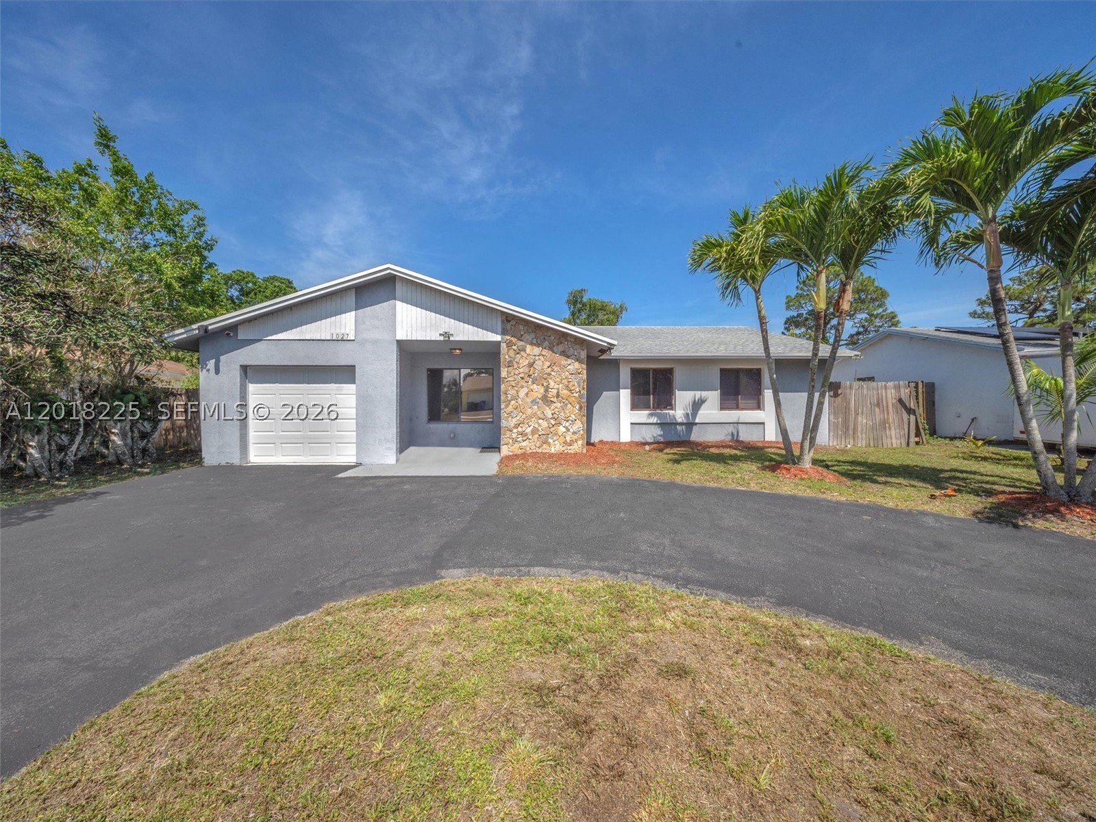 Welcome to your sweet home in Margate, Florida. This beautiful 3-bedroom, 2-bathroom home with a one-car garage has no rear neighbors, providing greater privacy. Enjoy a circular driveway with ample parking space for your family and guests. Inside you will find ceramic tile floors throughout, a spacious combined living and dining room, and an enclosed Florida room perfect for an office, playroom, or relaxation area. Step out into the large backyard with room for a pool or garden, and mature fruit trees including an orange tree, lemon tree, lime tree, and mango tree. The roof was replaced in 2022, giving you peace of mind for many years to come. Located in the heart of Margate, close to shops, restaurants, parks, and major highways, and just minutes from Coconut Creek, Coral Springs, the beaches, and Calypso Cove. Don't wait any longer and schedule your private showing today to make this house