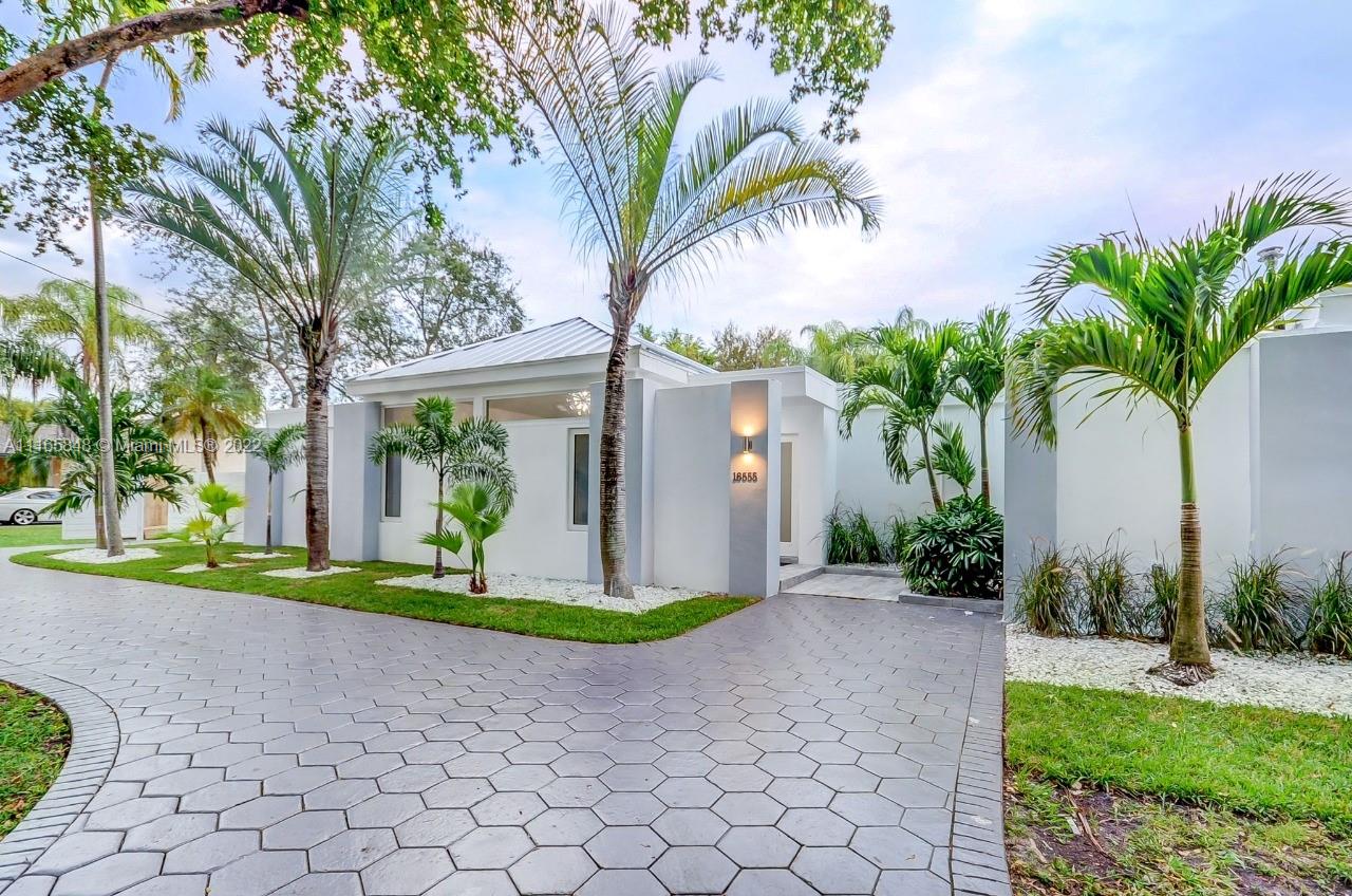 Spectacular fully remodeled home on a 15,000 SF double-lot currently operating as a luxury vacation rental generating 15k-18k per month in gross revenue. Perfect for an end user or an investor looking for cash flow from a vacation home. No expense was spared on the renovations. Easy to show. Features a heated/salt swimming pool, garage, new roof, 5 bedrooms, 3 bathrooms, gas appliances, fully updated electric and plumbing.