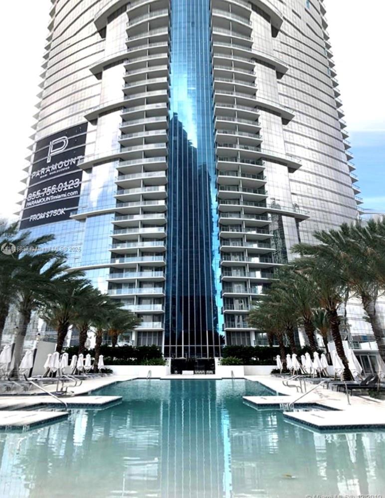 FULLY FURNISHED 2BD+DEN/3BTHS LUXURY BUILDING PARAMOUNT MIAMI WORLD CENTER. OVERSIZED BALCONY OVERLOOKING MIAMI SKYLINE, PRIVATE ELEVATOR TO THE UNIT. GREAT LOCATION. WALKING DISTANCE TO VIRGIN TRAIN STATION, BAYSIDE, AMERICAN AIRLINES ARENA, ART MUSEUM AND ENTERTAINMENT. BASIC INTERNET, CABLE, AND WATER INCLUDED. PLENTY OF AMENITIES AND SERVICES. FIVE POOLS, BASKETBALL COURT, BOXING COURT, RACQUETBALL, YOGA, SAUNA, SPA, ULTIMATE GYM, BBQ KITCHEN, VIRTUAL GOLF, RECORDING STUDIO, KIDS PLAY AREA. COMING SOON: SOCCER FIELD, TENNIS COURT, SKY DECK, OBSERVATORY. JACUZZI ON 53rd FLOOR OVERLOOKING MIAMI SKYLINE. 24 HRS CONCIERGE, VALET PARKING, SECURITY. UNIT COMES WITH TWO CAR SPACES (ONE ASSIGNED, ONE VALET)