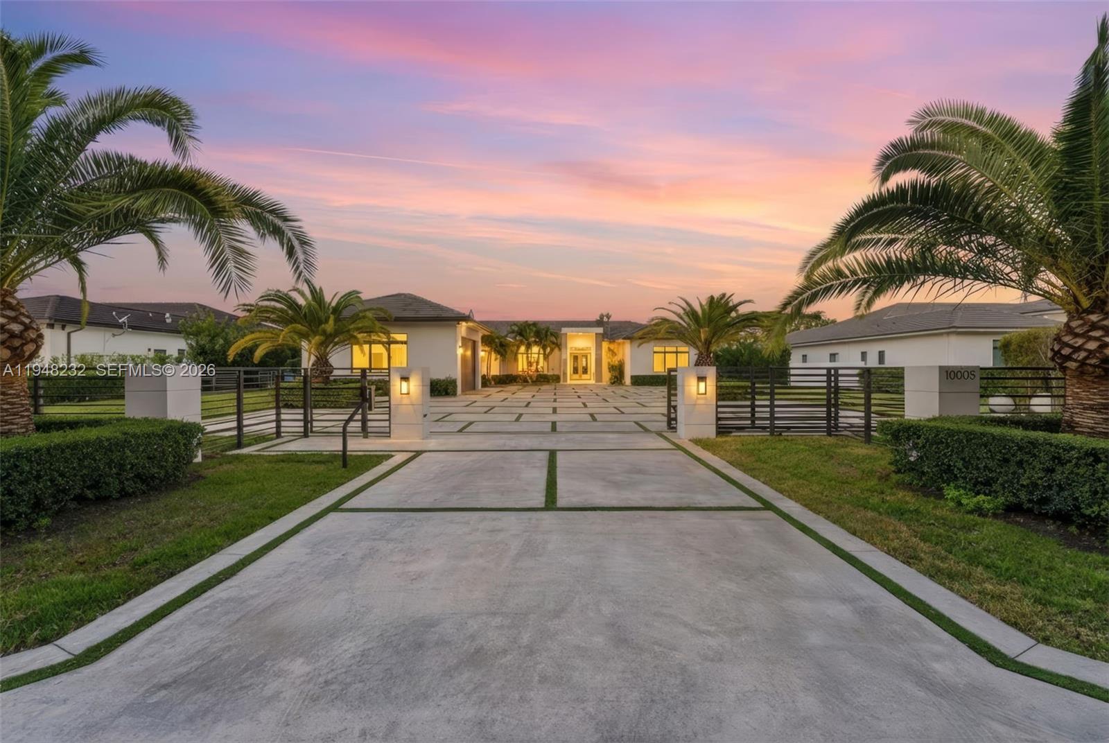 Elegant, expansive, and perfectly positioned in a peaceful neighborhood, this stunning newer-construction luxury estate offers 6 bedrooms, 7 bathrooms, and 5,850 sq. of refined single-story living. Designed with an open-concept layout, the home features soaring ceilings, exquisite chandeliers, and sophisticated architectural details that create a bright, welcoming atmosphere throughout. The thoughtfully planned split layout enhances privacy, while the primary suite serves as a true retreat with a spacious walk-in closet and spa-inspired bathroom. Ideal for entertaining, the designer kitchen and elegant living spaces are complemented by a custom wine display and seamless indoor-outdoor flow. The resort-style backyard includes a heated pool, outdoor BBQ area, and ample space to add a guest house, private gym, or pickleball court. Built for both luxury and resilience, the property offers spray-foam roof insulation, a full-house gas generator, storm drainage surrounding the home, Sonos sound system, evenly distributed Wi-Fi, and security cameras. Additional highlights include a massive driveway, lush tropical landscaping with coconut, guava, and ciruela trees, abundant natural light, and no HOA. Conveniently located near top-rated schools, dining, and major conveniences, this exceptional residence delivers privacy, sophistication, and endless possibilities in a highly sought-after neighborhood.
