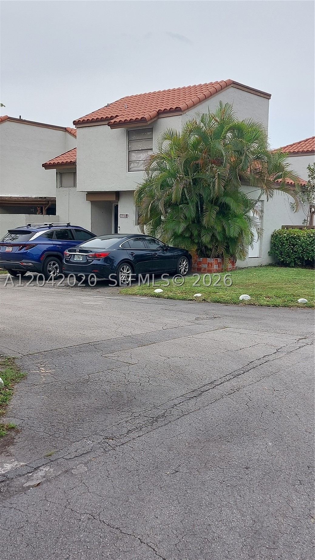 Welcome to this spacious and centrally located 3-bedroom, 2-bathroom townhome/villa in the highly desirable Caribbean Springs Village community. This two-story residence features tile flooring throughout the main living areas and attractive wood flooring on the staircase.  The thoughtfully designed layout includes one bedroom and a full bathroom on the first floor, making it ideal for guests, extended family, or a home office. Enjoy a large living and dining area perfect for everyday living and entertaining.  The updated kitchen is equipped with stainless-steel appliances, and a separate full laundry room adds convenience and extra storage space.  The community features two assigned parking spaces directly in front of the unit, ample guest parking, community swimming pool, tennis courts, and a children's playground.  Conveniently located in the heart of the Fontainebleau area, this home offers easy access to major highways, shopping, dining, schools, and entertainment.  **Professional photos coming soon**
