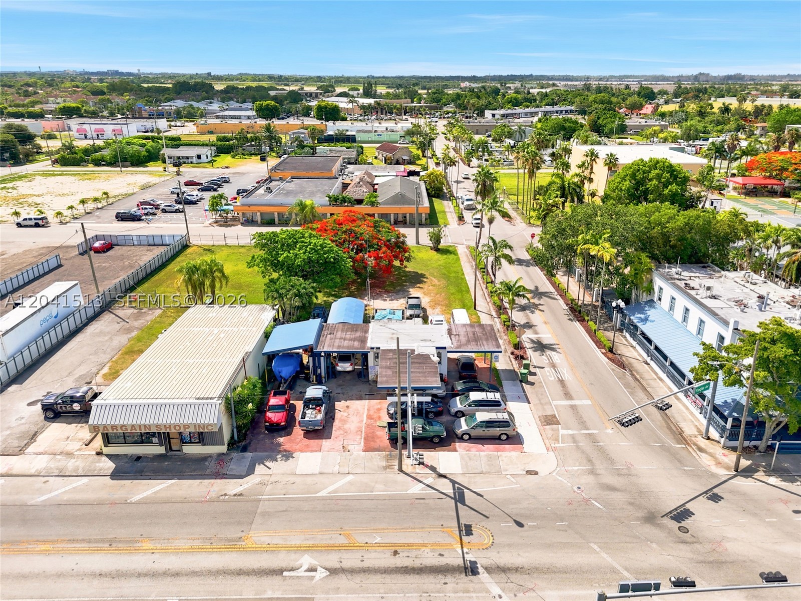 A rare 15,000 SF commercial lot in the heart of Homestead, currently operating as an auto repair shop. Zoning permits an exceptionally broad range of commercial uses automotive sales and service, retail, restaurants, office, banking, and more giving buyers true flexibility to continue the existing operation or reposition the site entirely. Located just steps from Historic Downtown Homestead, a National Register district, the property sits in one of South Miami-Dade's fastest-growing corridors, surrounded by active new construction and ongoing development. This is the kind of site developers and investors look for before an area fully builds out strong land value, broad zoning flexibility, and a location that only gets stronger as Homestead continues to grow. Whether you're looking to hold, build, or expand an existing operation, this lot offers a rare combination of size, location, and use flexibility that is increasingly difficult to find in this market. Showings by appointment only. Do not disturb business or employees. Contact listing agent for details.