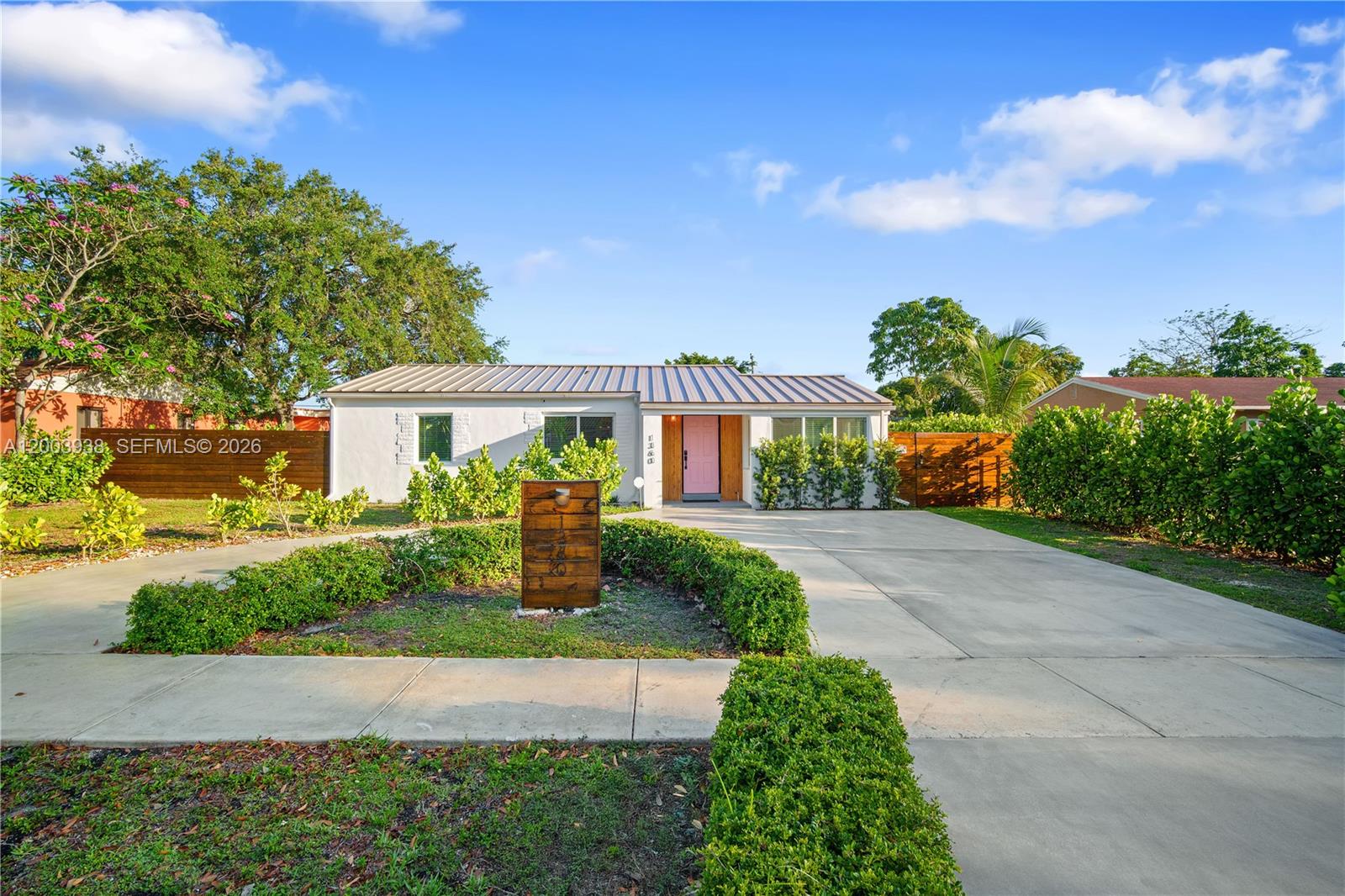 A fully remodeled home that offers all the Miami charm combined with comfort choices to fit a modern lifestyle.
The living area is designed around a spacious open-concept kitchen. A volume ceiling master bedroom as well as
four additional bedrooms offer enough light, space and air to spread out, while several patio doors create a
seamless indoor-outdoor living space, extending into a private back yard that features a new heated saltwater
pool. New metal roof, impact windows and doors, upgraded systems and comfortable access and parking on a large circular driveway. The property is warm and inviting and represents a complete home in the center of
everything that makes North Miami a great place to live. The house is located outside of flood zone, which offers
great long-term benefits.