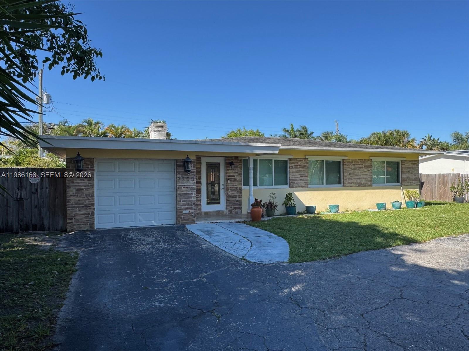 INVESTORS DREAM! Welcome to Santa Barbara Estates, where style, comfort, and opportunity come together in this beautifully renovated South Florida pool home walkable to Atlantic Blvd. and Pompano Beach. Featuring 3 bedrooms and 2 baths, this move-in-ready residence is ideal as a full-time home, seasonal retreat, or income-producing Airbnb/VRBO opportunity with no HOA fees or restrictions. Inside, the open-concept design is made for entertaining, centered around a chef-style kitchen with a large granite island, custom real-wood cabinetry, and newer appliances. The living and dining areas flow effortlessly to the outdoor oasis, creating the indoor-outdoor lifestyle buyers love. The spacious primary suite offers French doors opening directly to the travertine-paved pool, patio, and outdoor kitchen—your own private retreat for relaxing or hosting guests. Thoughtful upgrades include impact windows throughout, an impact garage door, updated electrical wiring, a tankless water heater, and newer central A/C for added comfort and peace of mind. A one-car garage and oversized circular driveway provide ample parking for residents and visitors alike. Located close to beaches, restaurants, shopping, and all the exciting new growth in Pompano, this exceptional property offers the perfect blend of convenience, charm, and flexibility. Don’t miss the chance to own a turnkey tropical escape with outstanding lifestyle and rental potential. Currently rented until 11-01-26 DO NOT DISTURB TENANTS