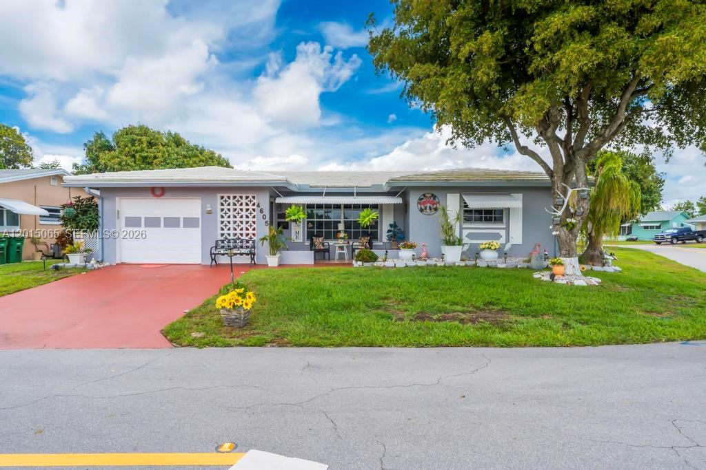 Welcome to this beautifully maintained 2-bedroom, 2-bath home located in the highly sought-after 55+ Mainlands of Tamarac community. One of the largest models in the neighborhood, this spacious corner-lot home offers an open and inviting layout with gorgeous hardwood floors throughout and beautifully updated bathrooms. Major upgrades include new piping throughout the entire home, updated electrical, a 2018 A/C, recently replaced water heater, and exterior paint completed just 4 years ago for added peace of mind. Enjoy the bright and airy feel, generous living spaces, and low-maintenance lifestyle this community is known for. Conveniently located near shopping, dining, parks, and major roadways. Don’t miss the opportunity to make this move-in-ready home your own! Photos have been enhanced by AI editing.