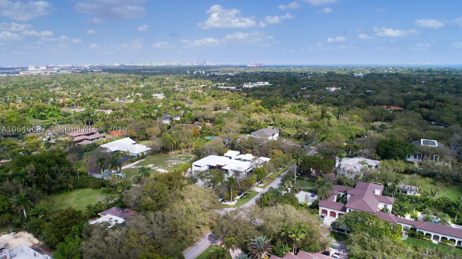 This stunning new construction estate is the perfect translation of luxury tropical modernism & the latest edition in the prestigious North Pinecrest. Ideal for a private retreat or a magical setting to entertain, this 8 SUITE BR, 10.5 baths,1.1 AC lot embodies an ultra-chic ingenious design that creates a unique oasis of world-class interiors & cutting-edge architecture. It's over 14,000 sf seamlessly blends w/the Tropical-Zen features such as resort style pool, stunning Ipe wood deck & unique checkers sundeck. All beautiful laid out to easily communicate with the spacious guest house, separate Clubroom & Gym. Surrounded by water features, separate barbecue area, cabana, large ext. terraces, marble floors, wine cellar, Italian doors & kitchn, Gated motor court, 4 CG, prewrd for smarthouse