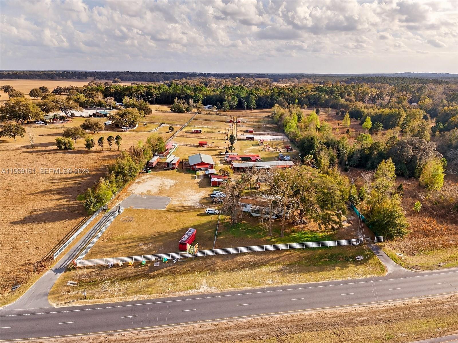 Turnkey petting zoo business established in 2013 featuring approximately 129 rescued animals (exotic and domestic), situated on 7.58 acres in unincorporated Marion County with direct frontage on W Highway 40 and just 4.7 miles from the World Equestrian Center.

The property is fully improved with extensive animal and agricultural infrastructure, including multiple barns, stalls, paddocks, perimeter fencing, carports, and support structures—allowing for immediate operation without the need for ground-up development.

A 3-bedroom, 2-bath manufactured home is located on-site and can be utilized for owner occupancy, staff housing, or operational support.

Zoned A-1 (General Agriculture) with a confirmed B-2 (Community Business) component, the property offers flexibility for a range of agricultural, commercial, and recreational uses. High visibility and paved road access along Highway 40 enhance accessibility and exposure.

This offering presents a rare opportunity to acquire an income-producing business, residential component, acreage, and existing infrastructure with strong upside potential in a high-growth corridor.

Buyer to verify all permitted uses, zoning, and financial information.