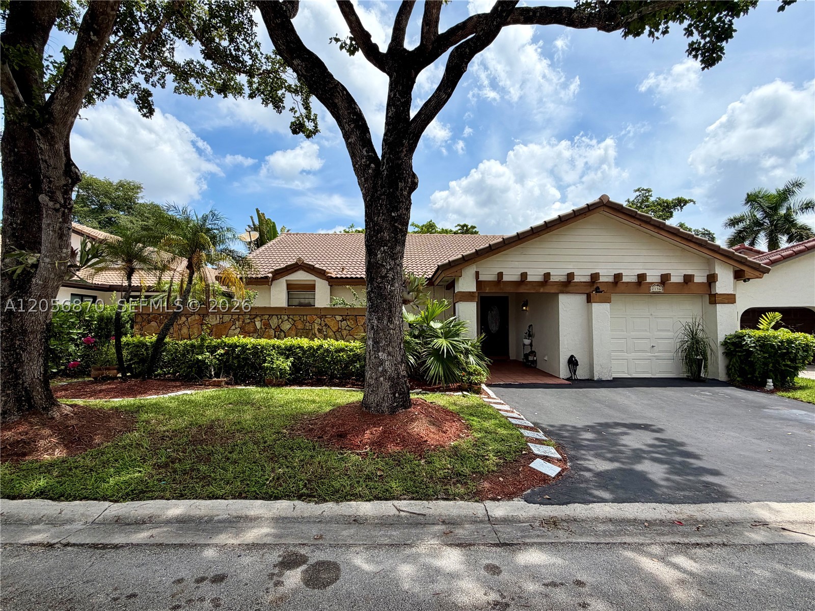 A spacious two-bedroom, two-bath single family home located in the desirable Weston area. Each bedroom has its own full bathroom, reading like two primary suites with enough room for a king size bed in each. Durable terracotta tile floors throughout, high pitched ceilings, large closet spaces, and a 300 square foot screened in patio/florida room overlooking a large yard. A mango tree was planted 3 years ago and just put out its first fruit this season! Sold as is, call the listing agent today for an appointment.

$150 HOA application fee per married couple or per single applicants/occupants 18 years or older.