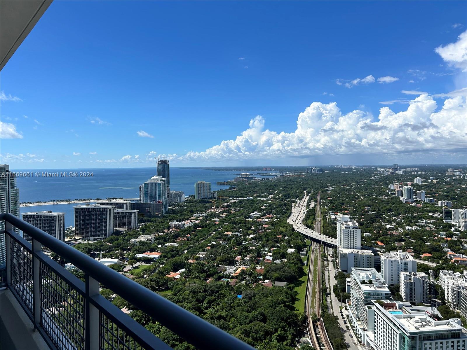 Wonderful flow-thru views from this 2 BD / 3 BA double high SKY LOFT. Amazing bay, ocean and city views. Porcelain floors throughout. Modern kitchen with granite counters and S/S appliances. Blinds on all windows, upgraded closets and baths. Two balconies, private access to rooftop with sun deck, jacuzzi and bar. State-of-the-art fitness center and SPA. 24 hour front desk and valet parking. Walk to Brickell Avenue and Mary Brickell Village.