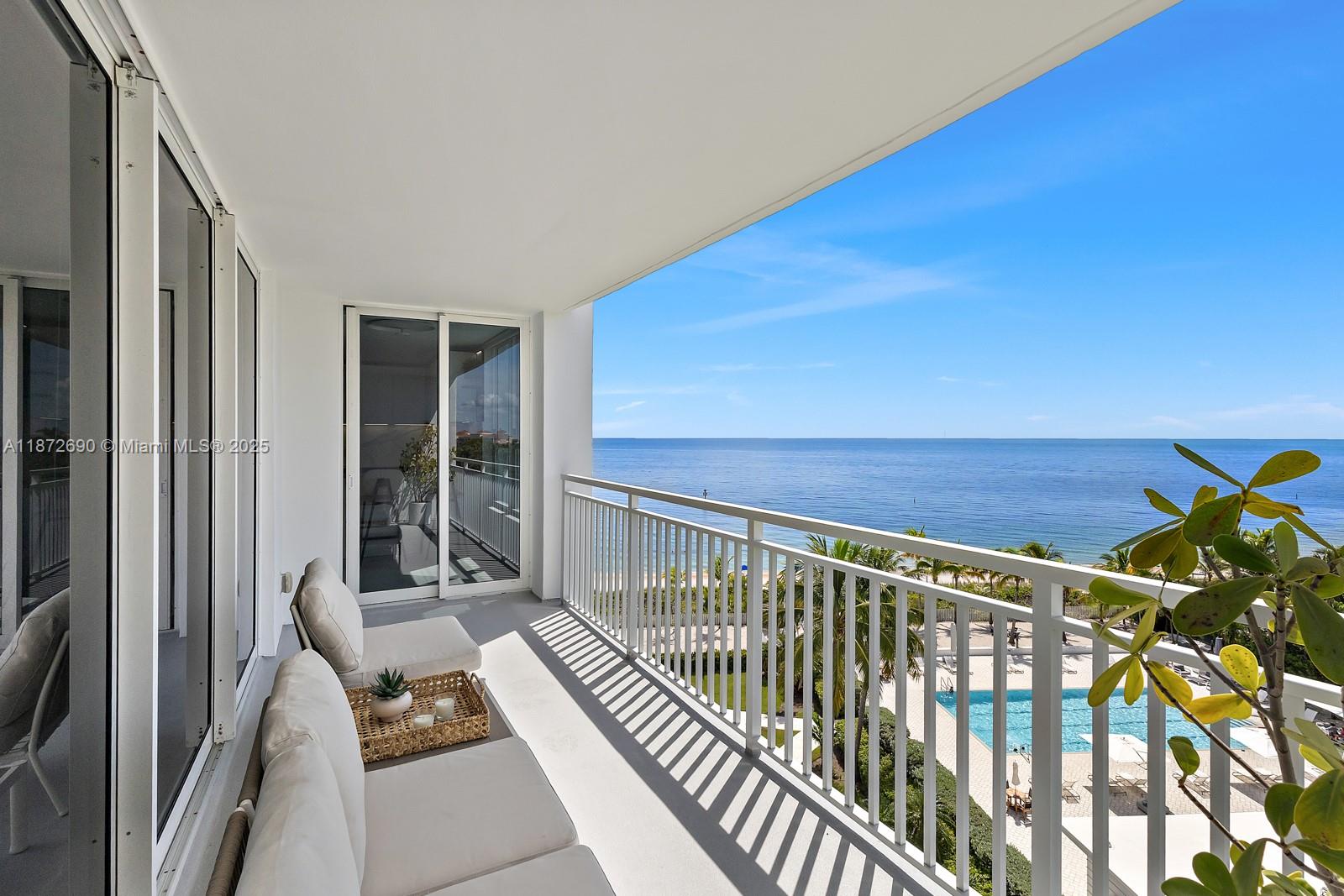 SEASONAL. Escape to this serene oasis in Key Biscayne—just steps from the beach where you can feel the sand and taste the salt air. This stunning and spacious oceanfront unit is located in the sought-after Sands Condominium. The closest 2-bedroom to the ocean on the Key, featuring a spacious master suite, guest room, and open living space. Exquisite marble flooring, custom kitchen and bathroom, new lighting and impact windows. Enjoy stunning sunrises and sunsets from your private balcony in this ultra-comfortable coastal retreat. Must see to appreciate! Easy to show.