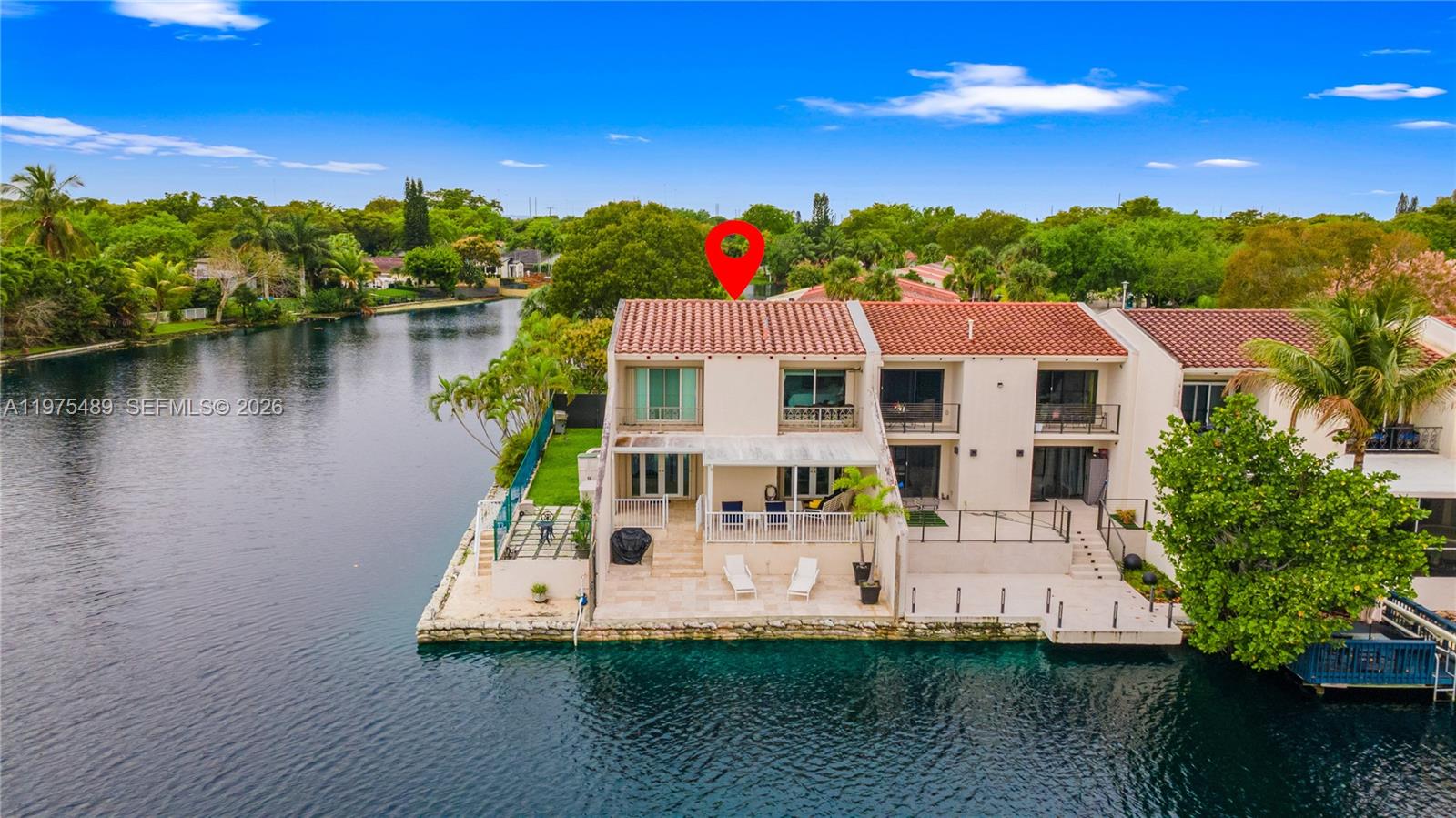 Lakefront living awaits you in this PREMIER TOWNHOME COMMUNITY! Corner unit with UNPARALLED  views of Lake Martha offer endless entertaining options. Enjoy the breeze on the fully tiled patio and OVERSIZED yard. Updated interior, kitchen, baths & Flooring, NEW A/C.  All Bedrooms offer a balcony. Private Cul de sac location.  The corner unit you have been waiting for is now available, MAKE IT YOURS!