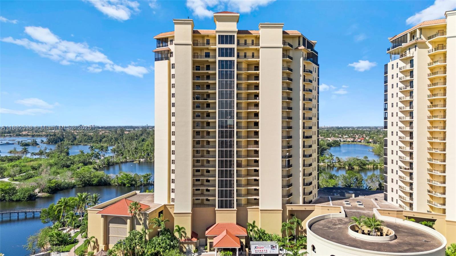 This 18th-floor South Tower condo offers stunning panoramic views of Lakes Park, blending luxury and convenience. The 3-bedroom, 2-bath unit features an open layout with upscale cabinetry, tile and carpet flooring, and neutral paint. The well-appointed kitchen includes a cooktop, microwave, and ample storage, while an A/C compressor and dryer add value. The spacious living and dining areas open to a private balcony, perfect for enjoying sunsets. Residents enjoy resort-style amenities, including a pool, two spas, a fitness center, and elegant social spaces. With two garage parking spots, pet-friendly policies, and a prime location near shopping, dining, beaches, and the airport, this condo is a must-see!