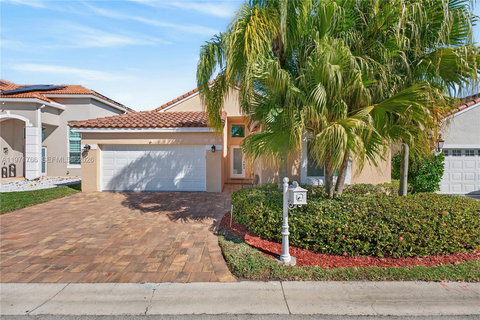 This stunning 3-bedroom, 2-bath waterfront home is move-in ready and waiting for its new owner! Designed for both comfort and style, the property features impact windows and doors, a 2019 roof, and a beautifully updated open-concept kitchen complete with rich dark wood cabinetry, quartz countertops, and stainless steel appliances. A convenient front-loading washer and dryer are also included. Travertine tile flows seamlessly throughout the home, while the bathrooms showcase elegant wood vanities and tasteful tile accents. Unwind on the spacious screened patio and take in peaceful water views — the perfect setting for morning coffee or evening relaxation. Ideally located just steps from the community pool, playground, and basketball court. Close to top-rated “A” schools, shopping, and dining. Please note: No leasing permitted during the first two years of ownership and no corporate ownership allowed. Association approval is required. See Broker’s Remarks for additional details.