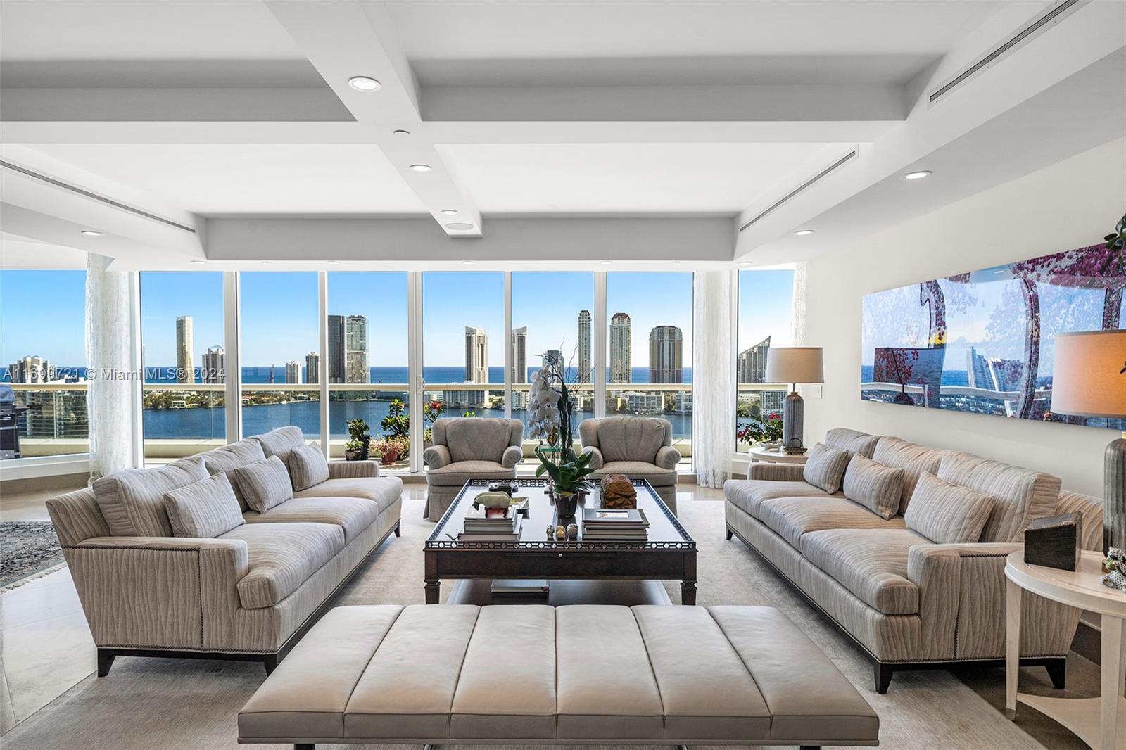 Penthouse-Style Luxury at Bella Mare. This 5-bedroom residence spanning over 4,400 sqft with breathtaking intercoastal and ocean views from expansive terraces. 
The unit features a fully renovated kitchen with a modern open island design, perfect for entertaining, as well as renovated bathrooms, including a luxurious primary suite. 
The spacious layout includes a grand living area and a cozy family room, ideal for hosting or relaxing. This is a house in the sky! Enjoy Bella Mare’s resort-style amenities, including a pool, spa, state-of-the-art fitness center, private theater, wine cellar, 24-hour concierge, and marina access. Nearby, Williams Island Club offers restaurants, spa, marina, tennis, and pickleball courts. This is luxury living at its finest!