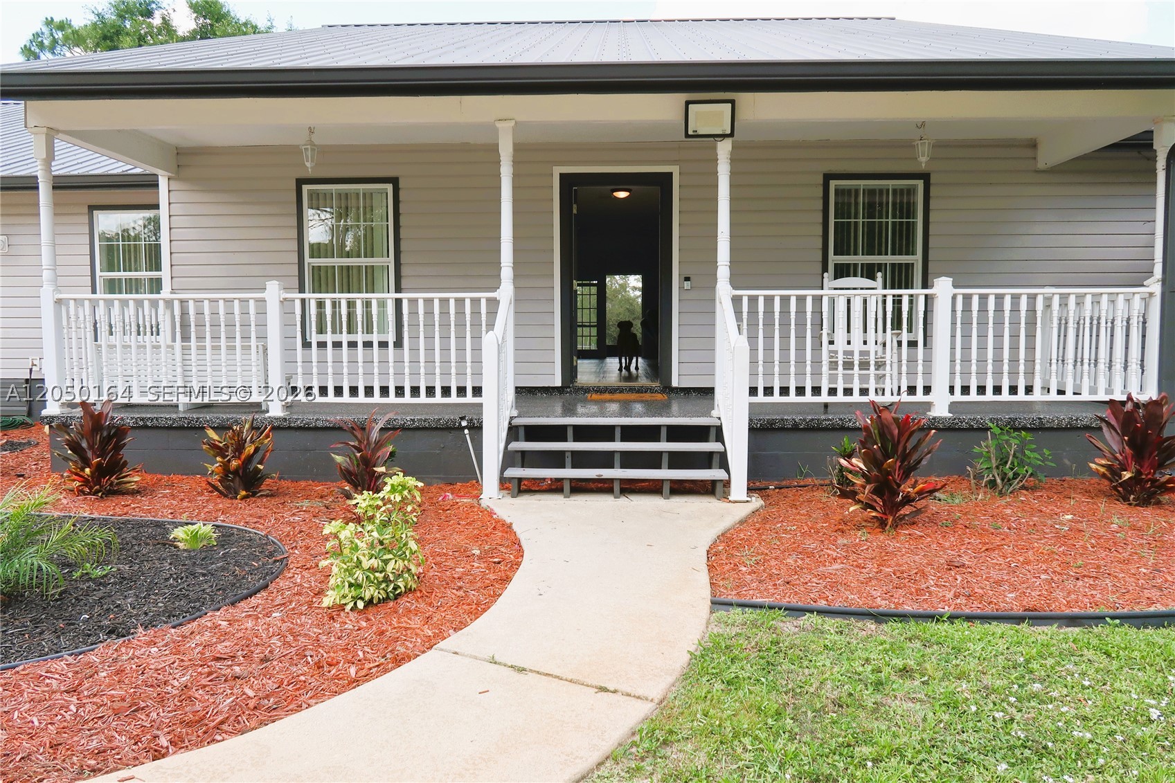 Discover the perfect blend of space, 1 ACRE  privacy and country living with this well-maintained 3-bedroom, 3-full bath, plus a private office/flex room with its own window and door.The home features two bedrooms with their own private bathrooms, offering added comfort and convenience. The property also features a spacious detached workshop with electricity and water, ideal for hobbies,storage,woodworking, plenty of room for RVs, boats, trailers or outdoor projects.Enjoy the peace and tranquility of country living while remaining just a short drive from shopping, restaurants and medical facilities.Home is being sold as is. The separate rear 1 acre parcel is not included in the sale and will be retained by the seller.