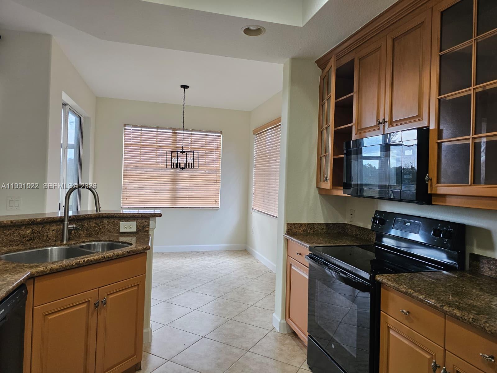 Tucked away in Heron Bay with resort style amenities such as pool, fitness center with state of the art equipment, multi-purpose banquet Hall, library, meeting rooms, sauna, water park for kids, outdoor racquetball and basketball courts for the family to enjoy. This well maintained home features 3 bedrooms, 2 bathrooms, spacious living room, waterproof laminated flooring in bedrooms, granite countertops in kitchen, and full sized washer and dryer, great garden view, no neighbors on the back, full garage! Close to A+++ schools, shopping centers and more! A must see!