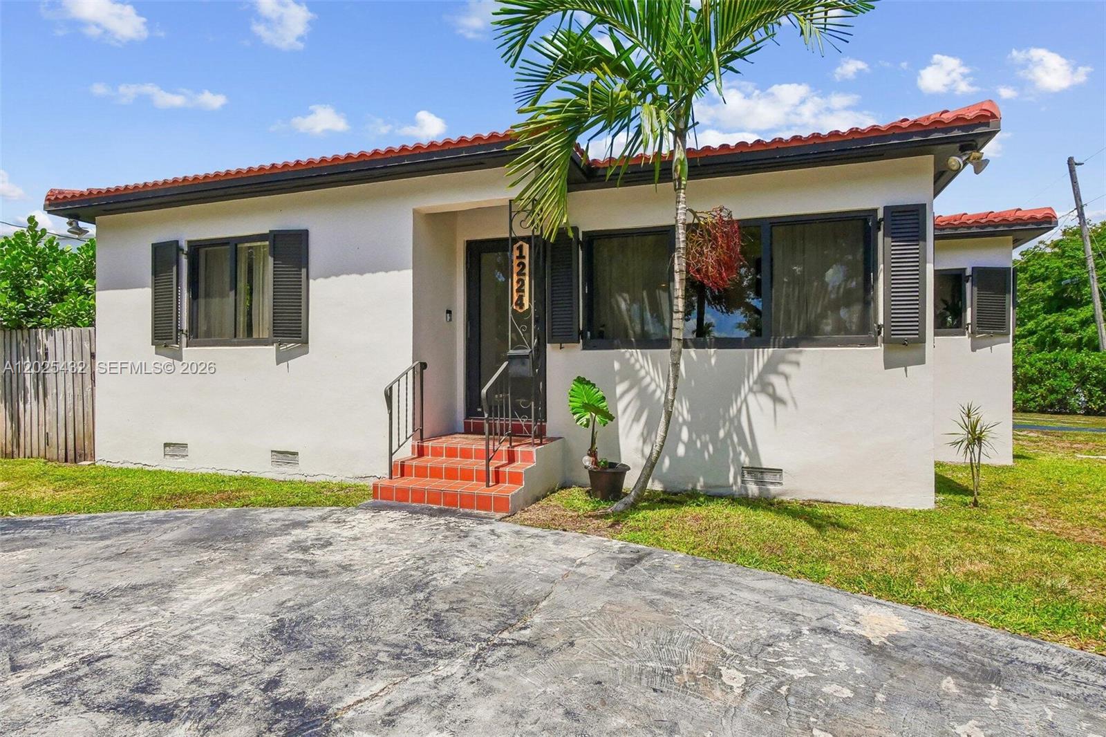 Turnkey 3BR + Studio Suite, 3 Miles to Beach, 10min to FLL airport, MASSIVE Corner Lot! Discover the perfect blend of security and opportunity in this 1,500 sqft. Hollywood gem. Located in a quiet neighborhood east of I-95, this home gives significant "big ticket" peace of mind with a 2021 roof, 2022 windows/doors & 2018 central AC. This home perfectly blends vintage character with modern amenities. Step inside to find charming original hardwood floors that lead to an updated kitchen and bathrooms. The main house feels bright with an artistic style! Step out back to a relaxing pool patio. The rear of the home has an attached mother-in-law suite with its own private entrance. If you’re looking to offset your mortgage with a rental or create the ultimate yoga studio this property delivers!