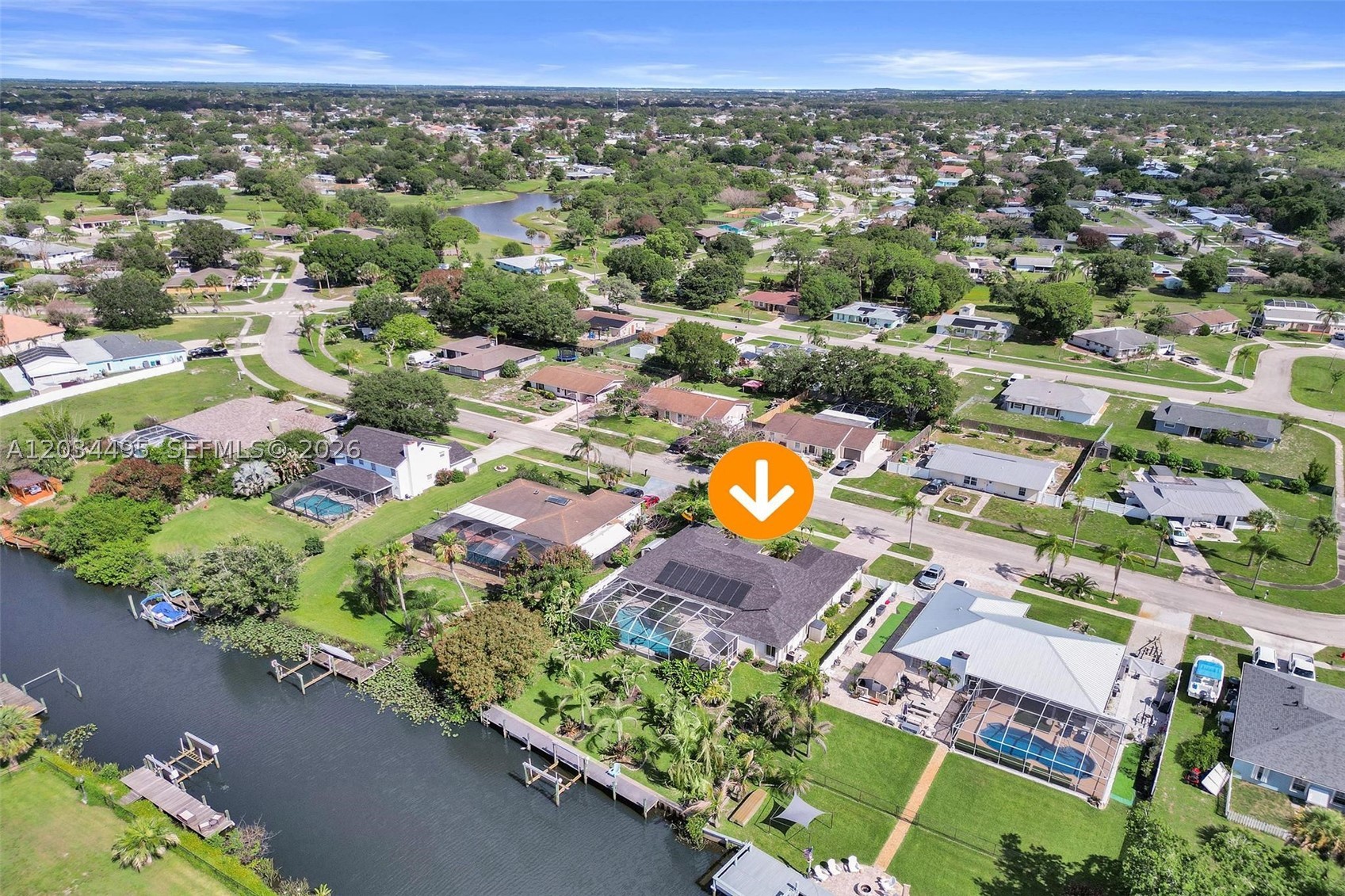 OCEAN ACCESS waterfront home with 90 feet of waterfrontage, concrete seawall, composite dock with electricity, and a 12,000 lb boat lift accommodating boats up to approximately 30 feet. Located just off the North Fork of the St. Lucie River with quick access to the Intracoastal and Atlantic Ocean. New roof and new A/C installed in 2024.

This CBS 4-bedroom, 3-bath home is designed around the water, featuring a heated saltwater pool with waterfall, separate hot tub, screened lanai, and multiple sliders opening to the outdoor living area. Updated kitchen with granite countertops, custom cabinetry, stainless appliances, large island, and abundant storage. Spacious primary suite with dual walk-in closets, dual vanities, frameless shower, soaking tub, and direct pool access.

Additional features include accordion shutters, water filtration system, EV charging outlet, professional landscaping, mature fruit trees, and excellent fishing right from the dock.

Boaters, anglers, and waterfront enthusiasts will appreciate the private dock with electricity, composite decking, and lift capacity for vessels up to approximately 30 feet, along with excellent fishing opportunities directly from the property.


Designer Mackenzie-Childs and custom Italian furnishings available separately.