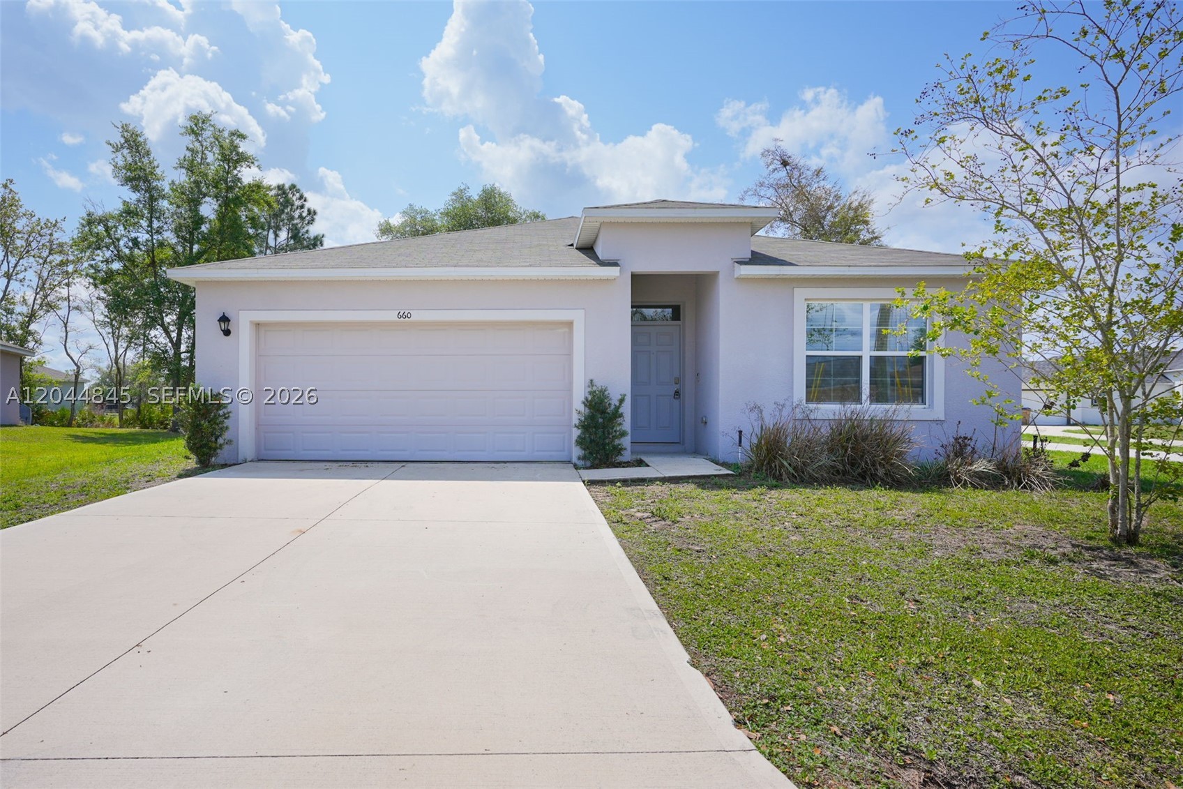 Welcome to this beautiful home built in 2022, offering modern construction, energy efficiency, and peace of mind. With the roof, impact windows, appliances, and major systems all installed 2022. Step inside to a bright and open layout designed for both comfort and functionality. The desirable split bedroom floor plan provides added privacy, with the primary suite set apart from the secondary bedrooms, perfect for families, guests, or a home office setup. The home features a modern kitchen layout and spacious living areas ideal for everyday living and entertaining. Natural light fills the space, creating a warm and inviting atmosphere throughout. This home is just a short drive from Walt Disney World parks, Universal Studios, and other world-famous Central Florida attractions, making it perfect for both primary residents and investors. Enjoy easy access to shopping, dining, schools, and major highways. Don’t miss your opportunity to own a home with modern features, a functional layout, within a short drive to Orlando’s top attractions!