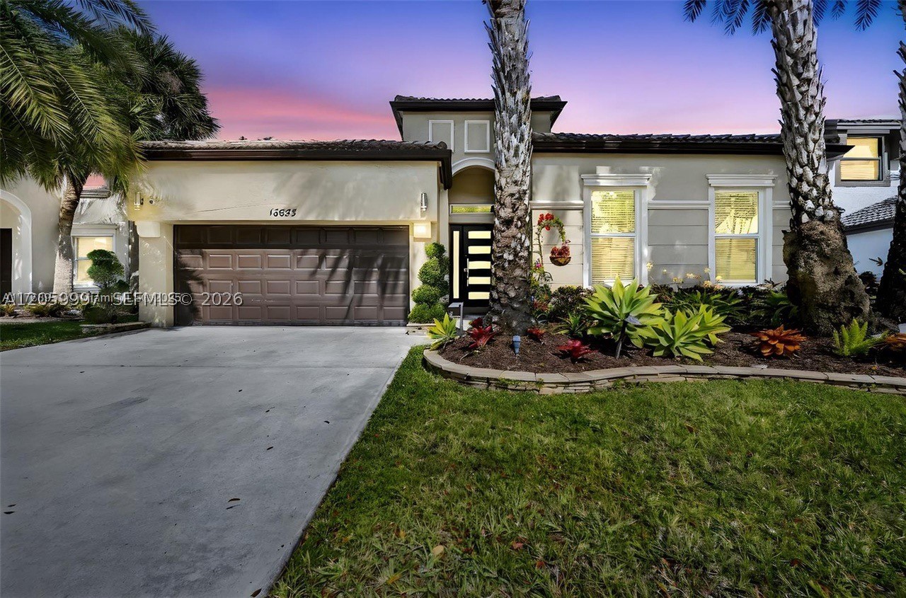 Welcome to this beautifully upgraded one-story home in the gated community of Riviera Isles. This 4-bedroom, 2-bath residence features an open floor plan with high ceilings, crown molding, and stylish finishes throughout. The gourmet kitchen offers soft-close cabinetry, stainless steel appliances, and upgraded 2-inch granite countertops. Additional highlights include hurricane-impact windows and doors, a Nest thermostat, luxury vinyl plank flooring in all bedrooms, tile throughout the main living areas, and a 2-car garage with an epoxy floor and extra storage. Relax or entertain on the covered paver patio with an awning. Enjoy resort-style amenities including a heated pool, fitness center, tennis courts, and more. Conveniently located near top-rated schools, shopping, dining, and major highways. Schedule your private tour today!