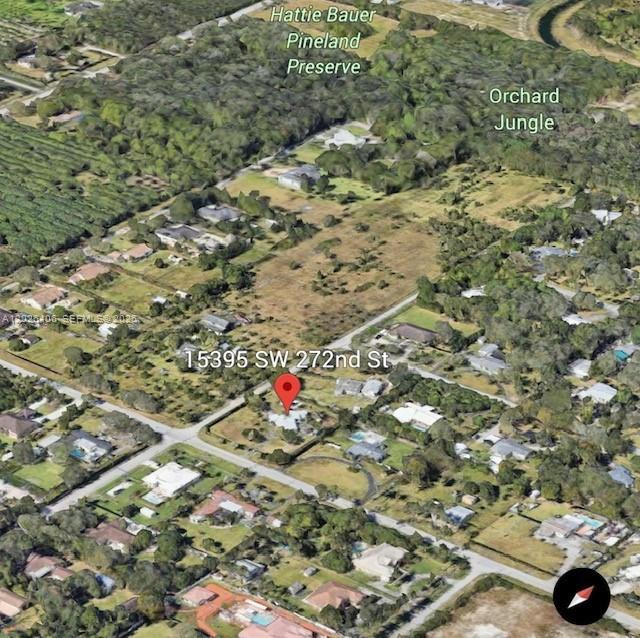 POTENTIAL REZONING OPPORTUNITY NEXT TO LA SALLE HIGH SCHOOL ATTENTION DEVELOPERS**** Exceptional development opportunity featuring approximately 1 acre of land with an existing 1,880 SF building, strategically located on a high-visibility corner at Epmore St & SW 272nd St in the Redland/Homestead area of Florida. Located directly adjacent to the new La Salle High School and just minutes from US-1, this property offers outstanding accessibility and exposure in one of South Florida’s rapidly growing corridors. The site is currently zoned Agricultural, presenting strong potential for future rezoning and redevelopment opportunities. With dual traffic access points, a large corner configuration, and excellent positioning near expanding residential and commercial growth, this property is ideal for developers, investors, or end-users seeking long-term upside potential.