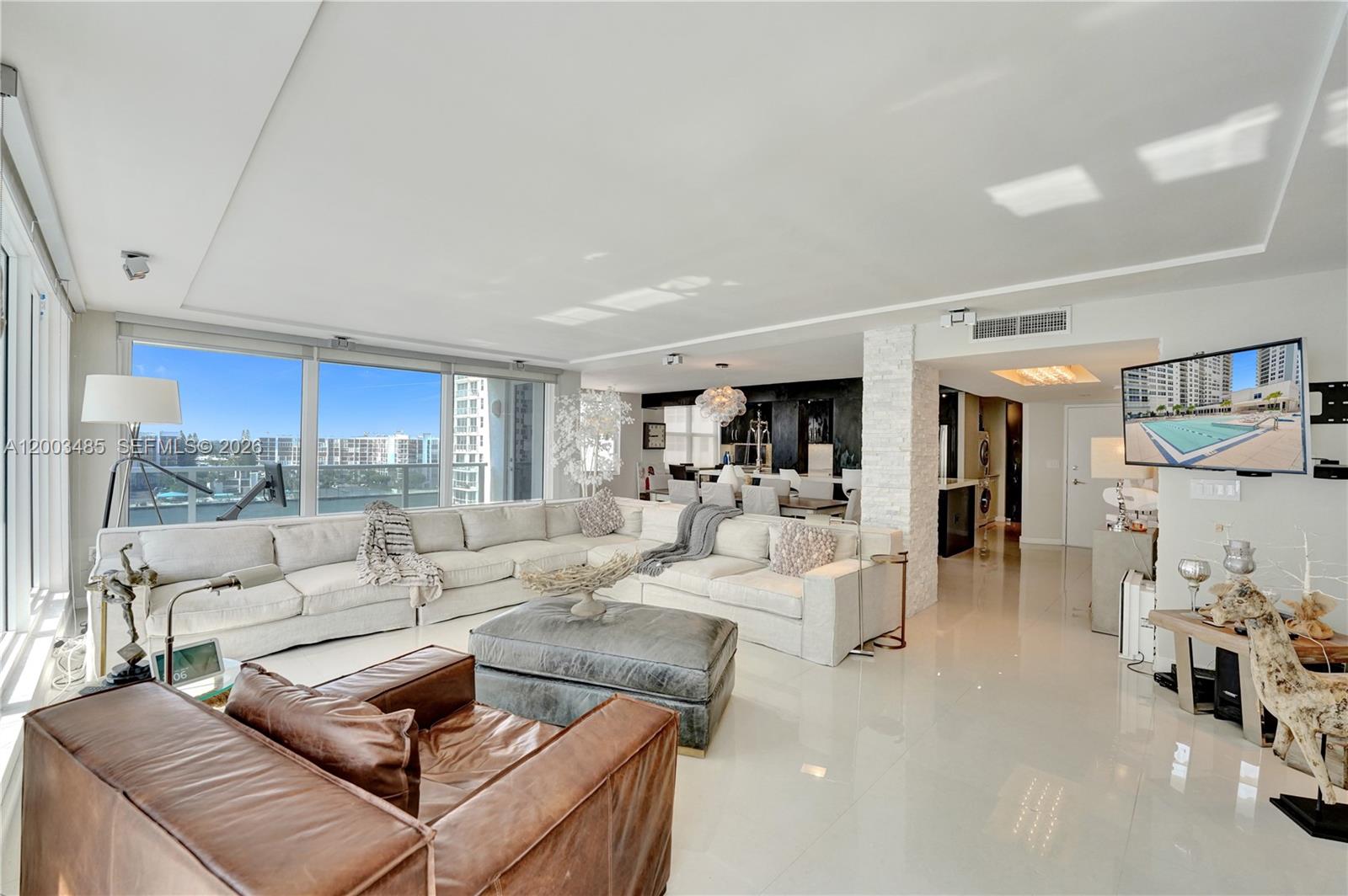 Beautifully upgraded 2-bedroom, 2.5-bath corner residence in Aquarius, oceanfront building on Hollywood Beach. This expansive 1,868 SF home— largest floorplan—offers a bright, open layout with an elegant chef’s kitchen featuring counter seating, pantry, and premium finishes. Enjoy a wraparound terrace, impact windows and doors, custom walk-in closets, and Bosch washer/dryer. The serene primary suite includes a spa-inspired bath for true retreat living. Sweeping ocean and Intracoastal views frame every room. Residents enjoy exceptional amenities: an on-site Italian restaurant, two heated pools, fully equipped gym, salon, game room, library, sauna, steam room, beach service, and valet. A perfect blend of sophistication and effortless seaside living.