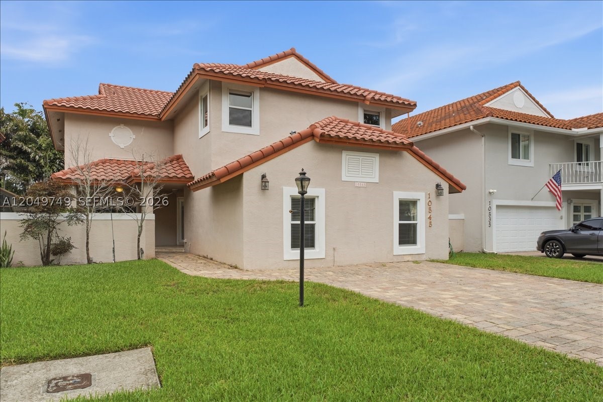 Welcome to this beautifully maintained two-story pool home in the prestigious 24-hour guard-gated community of Doral Dunes. Offering 4 bedrooms, 3 full bathrooms, and a flexible floor plan, this home combines comfort, functionality, and an unbeatable location. Features include impact windows and doors, spacious living areas, and abundant natural light throughout. The oversized primary suite includes a private sitting area, ideal as a home office, nursery, or fitness space, along with a beautifully appointed primary bath and a screened balcony overlooking the pool. A first-floor in-law or guest suite with a bedroom, full bath, and storage provides added privacy for guests or extended family. Enjoy South Florida living in the screened-in pool and patio, perfect for relaxing or entertaining year-round. Residents have access to the exceptional amenities of Doral Park Country Club, including a clubhouse, resort-style pool, fitness center, tennis and basketball courts, playground, restaurant, and more. Conveniently located near top-rated schools, parks, shopping, dining, Miami International Airport, and major highways, this is an exceptional opportunity to own in one of Doral's most desirable communities. Some photos have been virtually staged by Ellie AI.