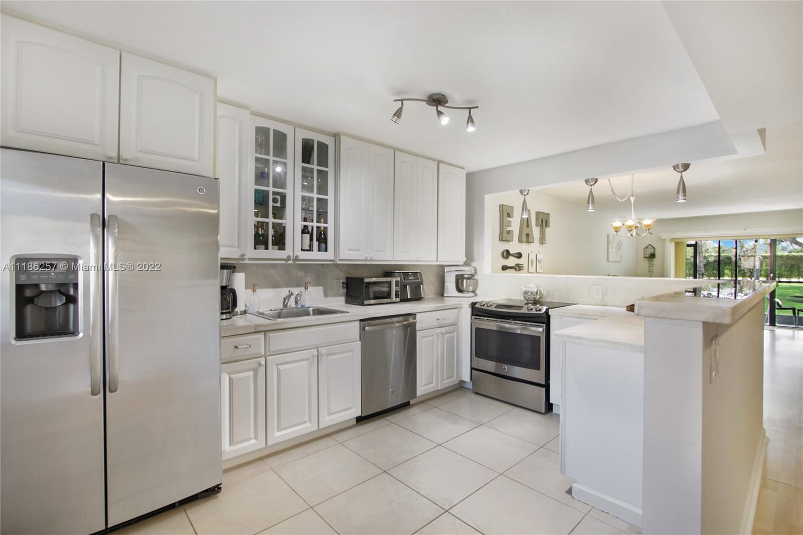 Do not miss your chance to own this spacious and charming first floor condo with direct access to a beautiful green space from its screened patio. Entry foyer leads into the upgraded kitchen and large dining and living room. The main bedroom window looks into the beautiful outdoor green space. Family oriented peaceful neighborhood in Weston. Recently updated AC unit. Designated parking space located right in front of the condo. Lots of rooms for storage: seven closets including a storage room. Enjoy all the amenities of Bonaventure Town Center Club located just minutes away!