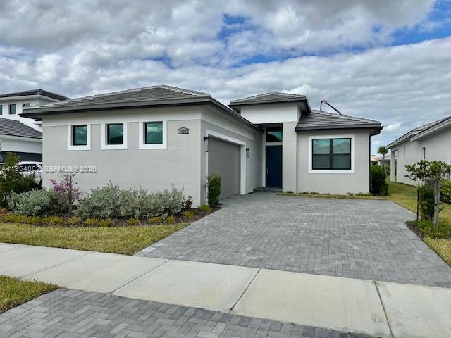 Brand New home built 2025 ! Never LIved in! Great lot with garden and lake views. 4 bedrooms and 3 full bathrooms. Crown MOulding through common araes, Hi hats in Living room, kitchen and Owner bedroom, fans and lights installed on ceilings, cabinets in pantry room and laundry, laundry tb, summer kitchewn ready, window blinds, tile to the rook in shower and bathtub, mirros to the roof on 2 bathrooms, outside camera  connection, flood light plus other upgrades, must see.Under Builders Warranty.