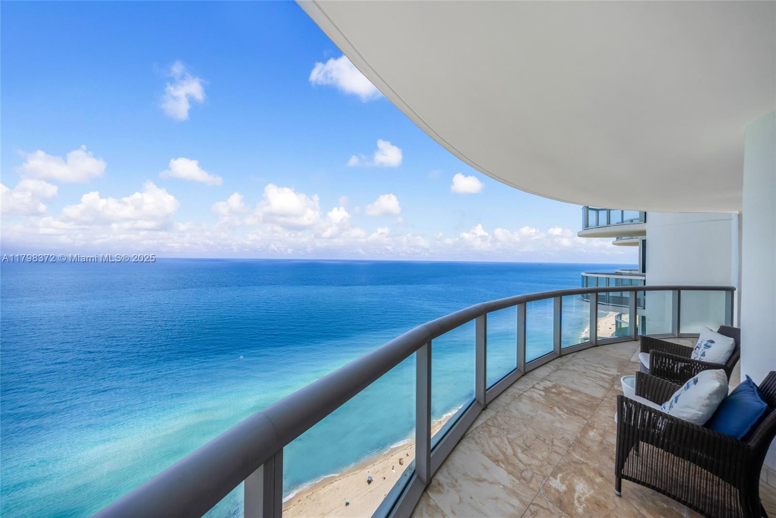 Stunning oceanfront condo rarely available and fully remodeled to perfection. This 2 bed, 2 bath residence offers breathtaking views, a fantastic split floor plan, and motorized blackout shades throughout. Enjoy built-in walk-in closets, dual sinks, a separate tub and shower in the primary suite, and an in-unit washer/dryer. The building has just unveiled its beautifully renovated pool and boasts resort-style amenities: beach service, valet, tennis courts, putting green, pickleball, sauna, state-of-the-art gym, billiards, and a striking lobby with attendant. Seamless access throughout with facial recognition security. A true coastal gem offering luxury, space, and comfort.