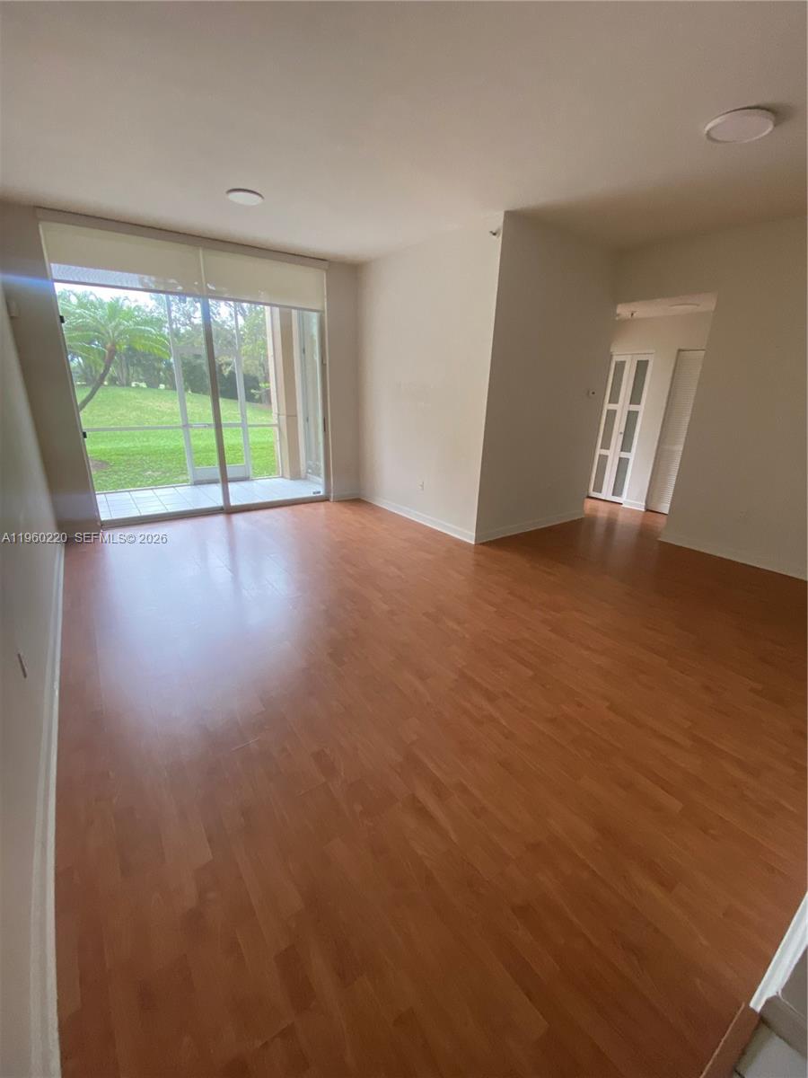 This stunning 1 bedroom, 1 bath condo offers 710 square feet of comfortable living in the Doral House Condo No. 1 community. Positioned on the first floor with a beautifull golf course views and spacious covered porch, the home features generous living and dining areas with a seamless flow. Enjoy  the golf course, and lake views from the bedroom  room and the porch, bright and opens living room area.  New washer and dryer. Residents enjoy access to the Doral Park Country Club, offering golf, tennis, a clubhouse, pool, fitness amenities, and more, all within a beautifully maintained setting.