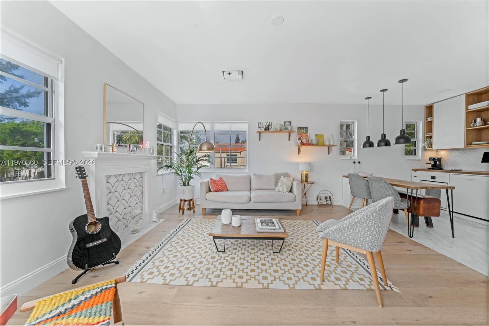 The beautiful Aloha Condo. Rarely available 2 bedroom, 2 bathroom plus parking, corner 2nd floor walk up with an abundance of windows and natural light. Situated on the prettiest, tree lined street in South Beach. Renovated and it includes a washer and dryer inside the unit. 940 SF in a truly unique boutique Art Deco building, no hallways and full of light. Assigned parking with secure entrance, walk to Flamingo Park (which offers an aquatic center, tennis court, fields and parks) as well as Esponola Way, Lincoln Rd shops, cafes & supermarkets all close by.