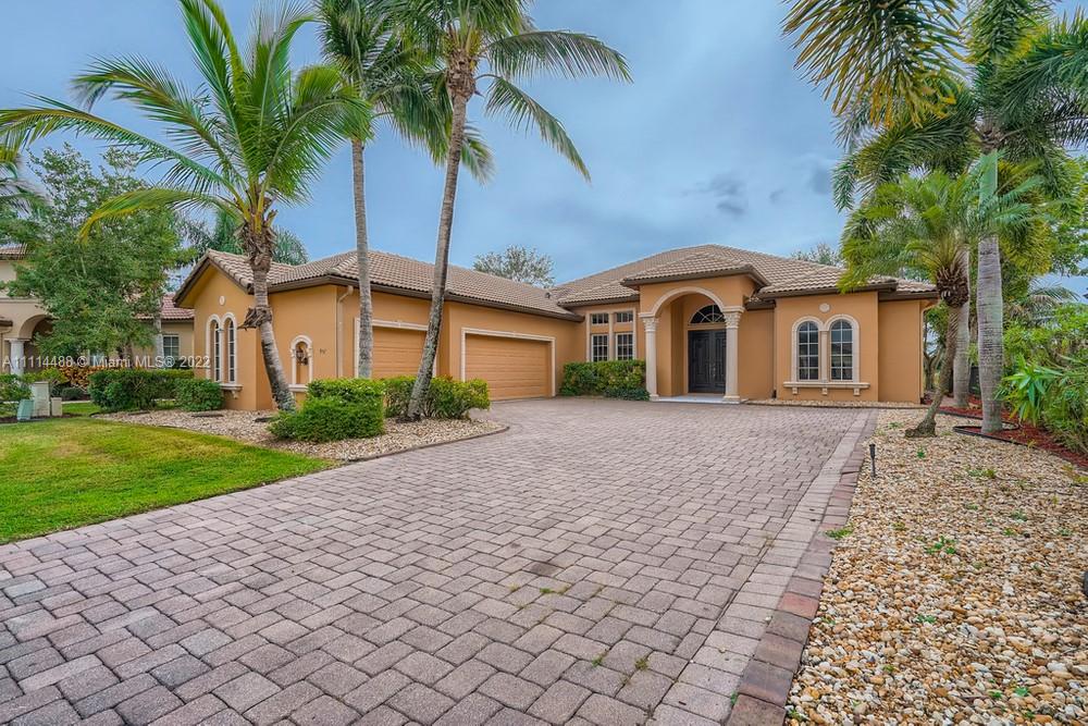 Stunning 4 bedroom, 2 bathroom home in the sought-after gated community of The Vineyards of St Lucie West! You will be greeted by a double-door entrance featuring a beautiful chandelier in the foyer. Follow the sleek flooring to the chef-friendly kitchen that you will fall in love with cooking in. This spacious, upgraded kitchen boasts stainless steel appliances, ample cabinetry, a large center island, and a breakfast bar. The grand primary bedroom will wow you with the two generous-sized closets and an en suite bathroom offering dual vanity sinks, a tiled shower, a soaking bathtub, and plenty of natural light. Retreat to the backyard that comes complete with a screened-in patio, pool, and spa perfect for entertaining guests and summer barbecues. Your dream home awaits!