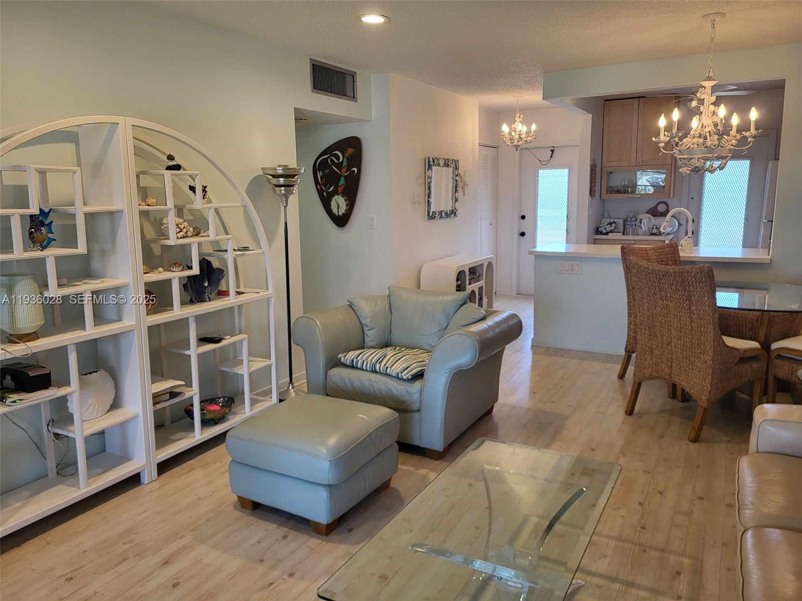 NICE REMODELED 2/2 CONDO WITH A BEAUTIFUL VIEW OF THE LAGOON FROM THE FLORIDA ROOM. VERY SPACIOUS UNIT WITH A LOT OF STORAGE. NEUTRAL FLOORING THROUGHOUT AND TILES IN THE BATHROOMS. CENTRALLY LOCATED, CLOSE TO SHOPS, GROCERIES STORES, PHARMACY. 15 MINUTES FROM THE BEACH. GREAT VERY WELL MANAGED COMMUNITY WITH A LOT OF ENTERTAINMENT. NO ASSESSMENT. NO RENTING FIRST 2 YEARS. FOREIGNER SELLER (FIRPTA) - BUYERS AGREES TO SIGN AN OCCUPANCY AFFIDAVIT AT CLOSING. EASY TO SHOW !!
