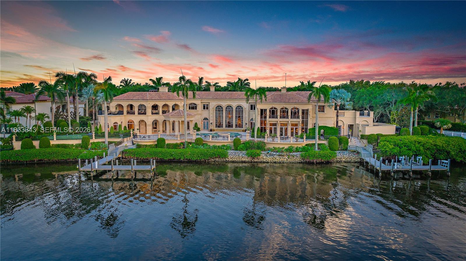 Introducing a palatial waterfront estate on a double lot in the exclusive community of Admirals Cove, where timeless design meets South Florida luxury. Situated on prime water frontage with two private docks, this architectural masterpiece offers 9 bedrooms, 13 baths, and a lifestyle defined by elegance and ease. Ideal for yacht owners and water enthusiasts, the property offers exceptional access and capacity for large vessels or multiple watercrafts. Every detail of the interior has been thoughtfully curated—from soaring ceilings and rich finishes to spacious living areas designed for both grand-scale entertaining and private retreat. . A dedicated 3-bedroom guest house ensures comfort and privacy for extended family or visitors,