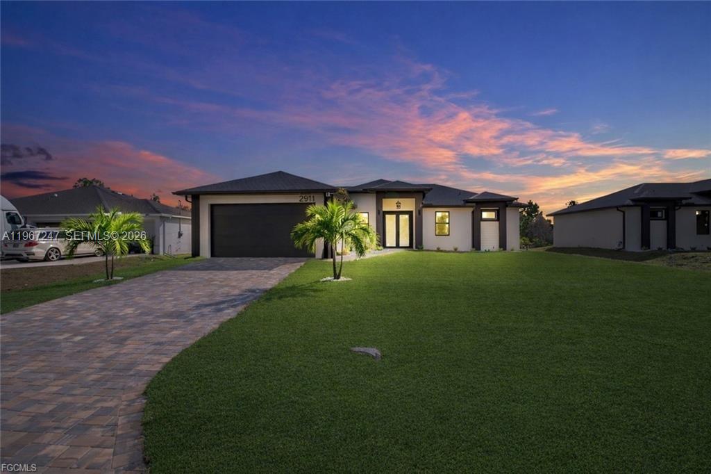 BRAND-NEW HOME • MODERN FINISHES • MOVE-IN READY
This new construction 4-bedroom, 3-bath home offers 2,391 total sq ft (1,778 under A/C), a 2-car garage, and a functional layout designed for comfortable everyday living. High ceilings, porcelain tile throughout, and a bright open-concept living area create a clean, modern feel.

The kitchen features a large quartz island, full backsplash, under-cabinet lighting, new appliances, and a spacious walk-in pantry. The primary suite includes a spa-style bath, while a second suite is ideal for guests or extended family. The fourth bedroom works perfectly as a home office or flex space.

Enjoy Florida living with 8-ft sliding doors to an extended lanai, epoxy-coated garage floors, impact windows and doors, paver driveway, and a whole-home water filtration system. Easy to show.