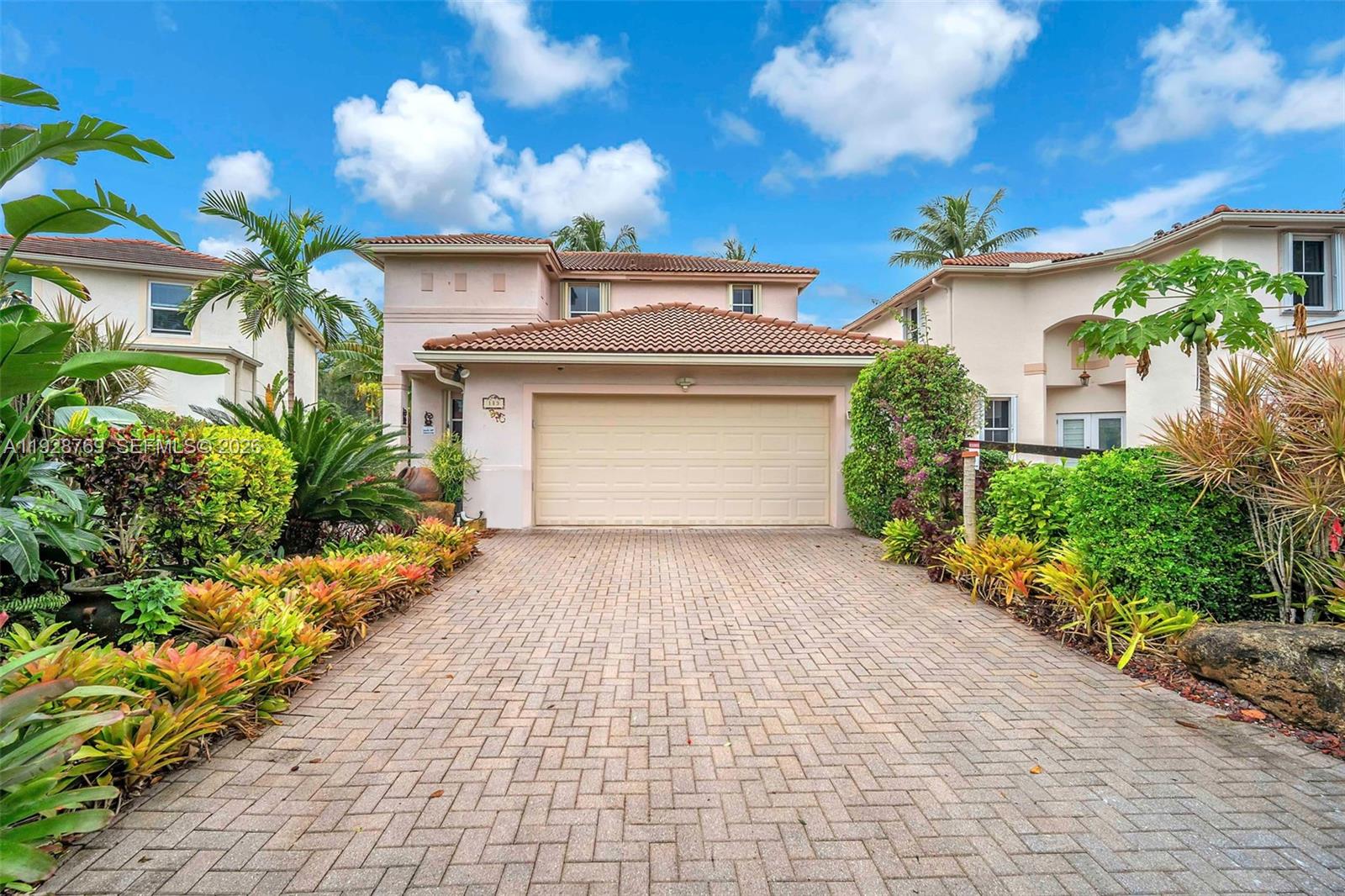 Lovely home with Italian flair, located in a quiet section of the well appointed Lakes of Newport in Broward County, a prime location between the Broward Mall and The Towne Square Shops, within walking distance. Large living quarters, spacious 2 car garage with plenty of storage and surrounded by CCTV and alarm system. New Trane AC system and Bosch dishwasher (2025) and new SS appliances. Unique landscape, manicured front, and lake backyard. Screened in porch, perfect for entertaining family and friends. Low HOA with plenty of amenities, 3 large pools, seldom crowded. Price reflects some spa repair and original roof. Contact agent for appointments.