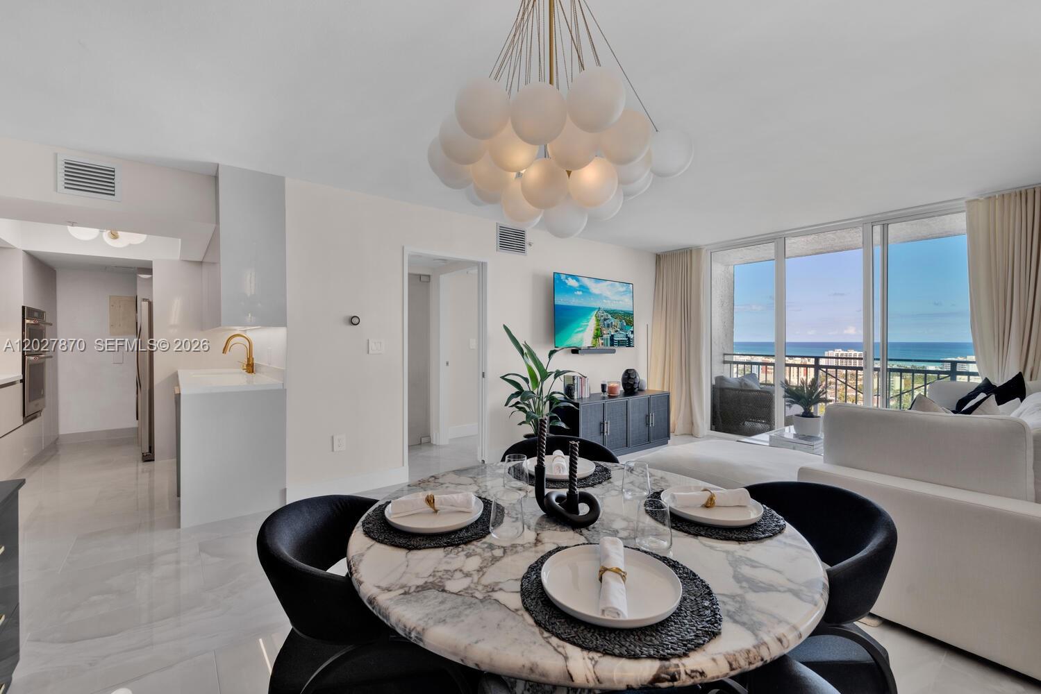 Step into luxury at the Yacht Club at Portofino, in the coveted South of Fifth neighborhood. This stunningly renovated residence offers a sleek, modern design with high-end finishes throughout. The kitchen boasts custom cabinetry, quartz countertops, and gold fixtures, while the spa-like bathroom features a backlit mirror and elegant accents. The living and dining areas exude sophistication with designer lighting and ocean views. The spacious bedroom offers custom closets and a chic feature wall. With a walkability score in the top 10, you're just steps from Miami's best restaurants (Carbone & Joe's Stone Crab), the beach, and South Pointe Park. Experience the pinnacle of South Beach living.
Come On Tour With Me!