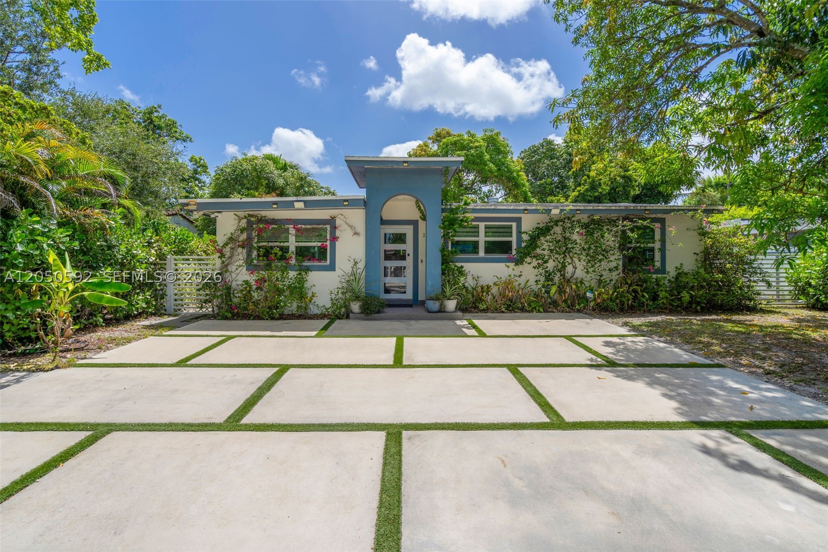 Discover this beautifully renovated, fully furnished home, thoughtfully redesigned with elegant Italian-inspired finishes that blend timeless style with modern comfort. From the custom kitchen and designer fixtures to the upgraded flooring, every space reflects quality craftsmanship and attention to detail. The fully gated and fenced property offers privacy, security, and peace of mind in a quiet, desirable neighborhood. Enjoy it as a spacious 4-bedroom, 3-bathroom home or configure it as a 2-bedroom, 2-bathroom main residence with a private 1-bedroom, 1-bathroom guest suite featuring its own entrance, kitchen, and living room—ideal for rental income, guests, or extended family. Additional highlights include impact windows and doors, a security system with 13 interior and exterior cameras recording 24/7, accessible from your phone or laptop anywhere in the world, an outdoor laundry room with storage, and custom-built sheds on concrete foundations. All furniture and wall art, including many signed by well-known artists, are included. The spacious yard is perfect for relaxing or entertaining. All improvements were completed with permits. Priced to sell and easy to show. Schedule your private tour today!