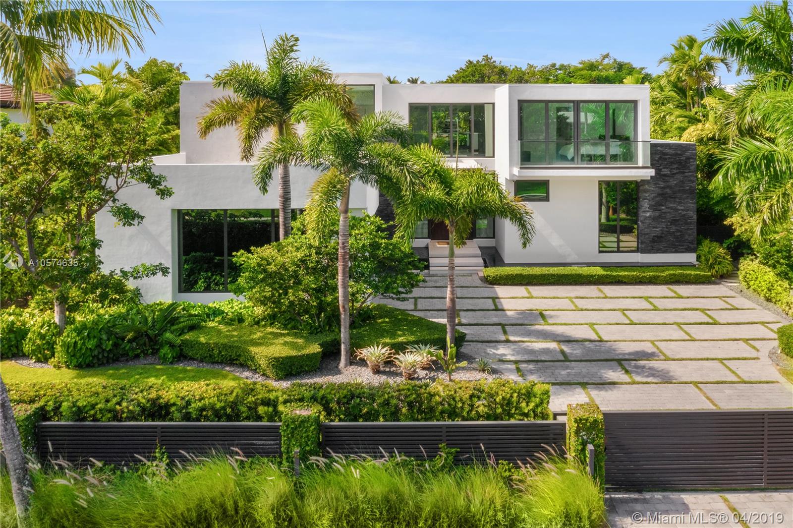 This brand new construction is located in the private community of prestigious Bal Harbour Village. With an exclusive marina available at all times, ideally located near the luxurious Bal Harbour Shops & across the ocean & the beach.The contemporarily designed house features its own gate which leads to the house’s main entrance, a floor to ceiling wooden door masterpiece surrounded by flowing water.  The property totals 7,548 SqFt, includes 7 bedrooms, 7/1 bathrooms, a 2 car garage & stands on a 12,364 lot. The two-story residence offers open & intimate areas for gathering and entertaining. Spectacular kitchen with top of the line finishes and Quartz countertops, open and spacious living and dining rooms. Fully equipped smart home. "Virtual Tour Included"