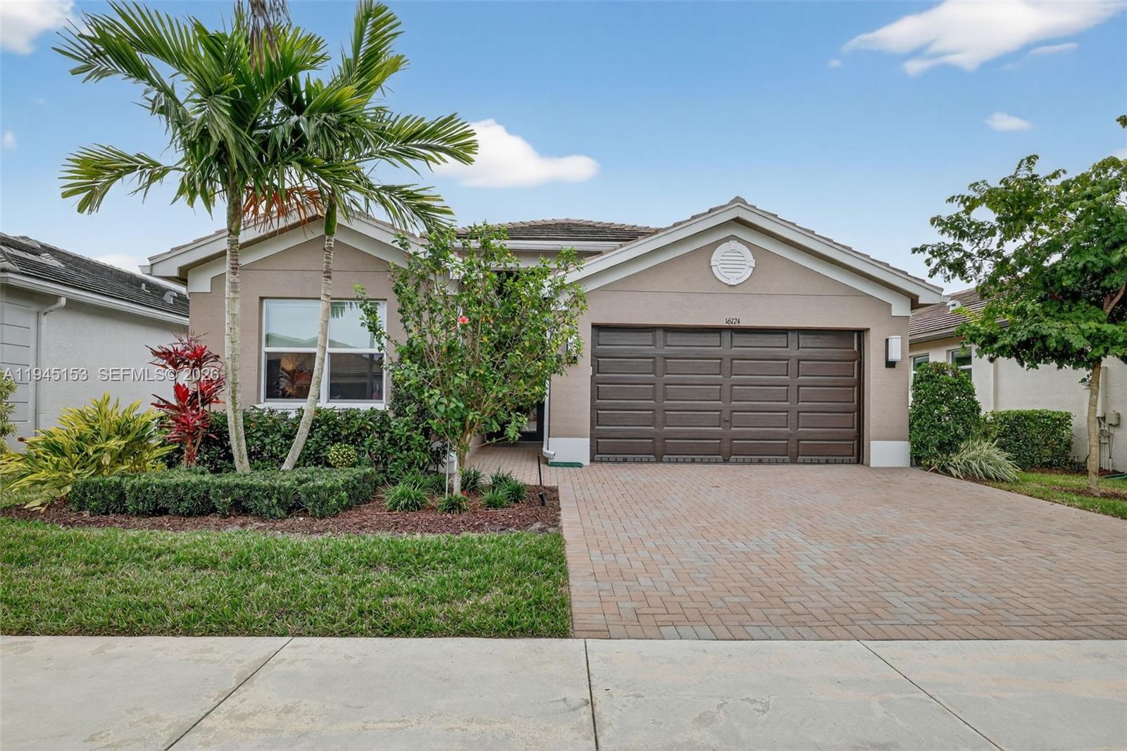 Welcome home to this impeccably maintained Heron model in sought-after Valencia Grove. This stunning residence showcases numerous upgrades completed both through the builder and after closing, offering refined style and comfort throughout. Features include elegant pocket doors, a striking glass entryway, a freshly painted interior, and an expanded driveway and walkway that enhance curb appeal. The primary bathroom impresses with floor-to-ceiling tile, while the kitchen is accented by a beautiful custom backsplash and upgraded appliances. Additional highlights include frameless shower enclosures, custom crown molding throughout, and premium Hunter Douglas custom blinds. Meticulously cared for and truly move-in ready, this home offers effortless luxury with nothing left to do—just unpack and enjoy the Valencia lifestyle.