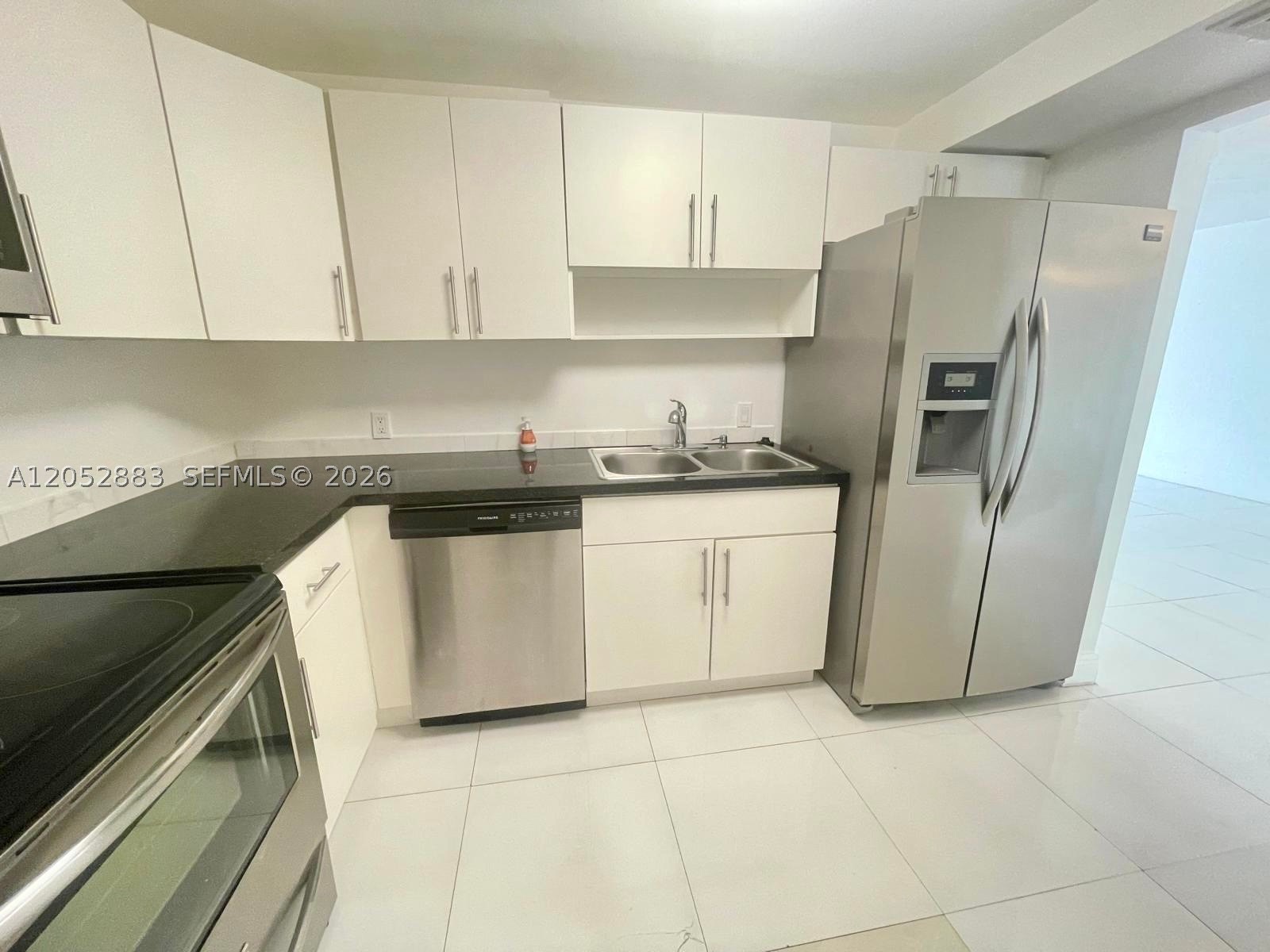 Spacious unit in Keystone Harbor Club - this 2 bedroom 2 bath split floor plan unit is ready for occupancy.  Incredible North Miami location - this building sits on the waterway right off of Biscayne Blvd and 135th st.  Boutique building with only 121 units.  This unit features an updated kitchen, tile floors, and oversized terrace, and much more.  Completely gated community, building features on site management office, pool, gym, and all-purpose community room.  Laundry facility in the building.