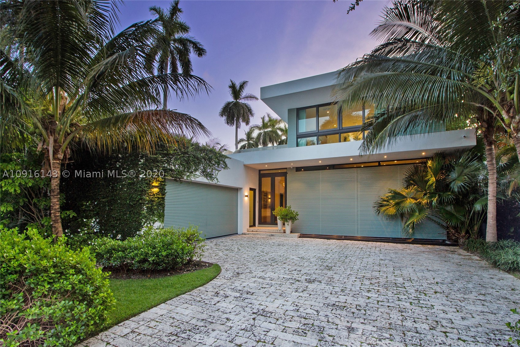 Stunning modern oasis on prestigious Sunset Island 3 that defines the perfect tropical Florida lifestyle. Large corner lot, newly constructed 5900 SF home, 6 beds, 7 baths, half bath, heated pool, 2 car garage, gated, lush tropical landscaping. Spacious and inviting, with lofted ceilings, gourmet kitchen, oak and marble flooring, and telescopic sliding doors that seamlessly blend indoor-outdoor living. Large covered lounge terrace, Ipe wood wall, reflecting ponds, wrap around pool, summer kitchen, cabana bath, canoe/board rack, and private guest suite. Spacious Master with private terrace, large closet, spa-like bath. Stylish, functional features include smart home system, rooftop terrace. Sunset Islands 3&4 are steps to Sunset Harbour shops and dining, moments from the beach & causeways.