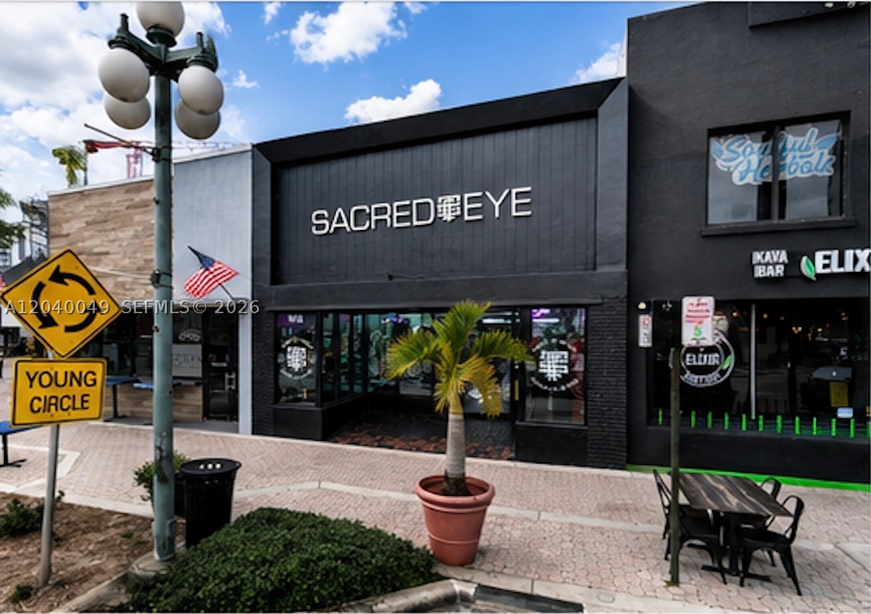 The subject property is a premier ±4,173 SF commercial building located directly on Young Circle in the heart of Downtown Hollywood. The property features a fully renovated, high-end interior with premium finishes, polished concrete floors, architectural lighting, extensive storefront glass, and an open floor plan currently configured as a luxury tattoo studio. The building is ideal for retail, showroom, wellness, beauty, medical, fitness, office, gallery, restaurant, or other creative commercial uses. The property benefits from exceptional visibility, strong pedestrian traffic, nearby public parking, and close proximity to Downtown Hollywood's restaurants, nightlife, and ongoing redevelopment projects.