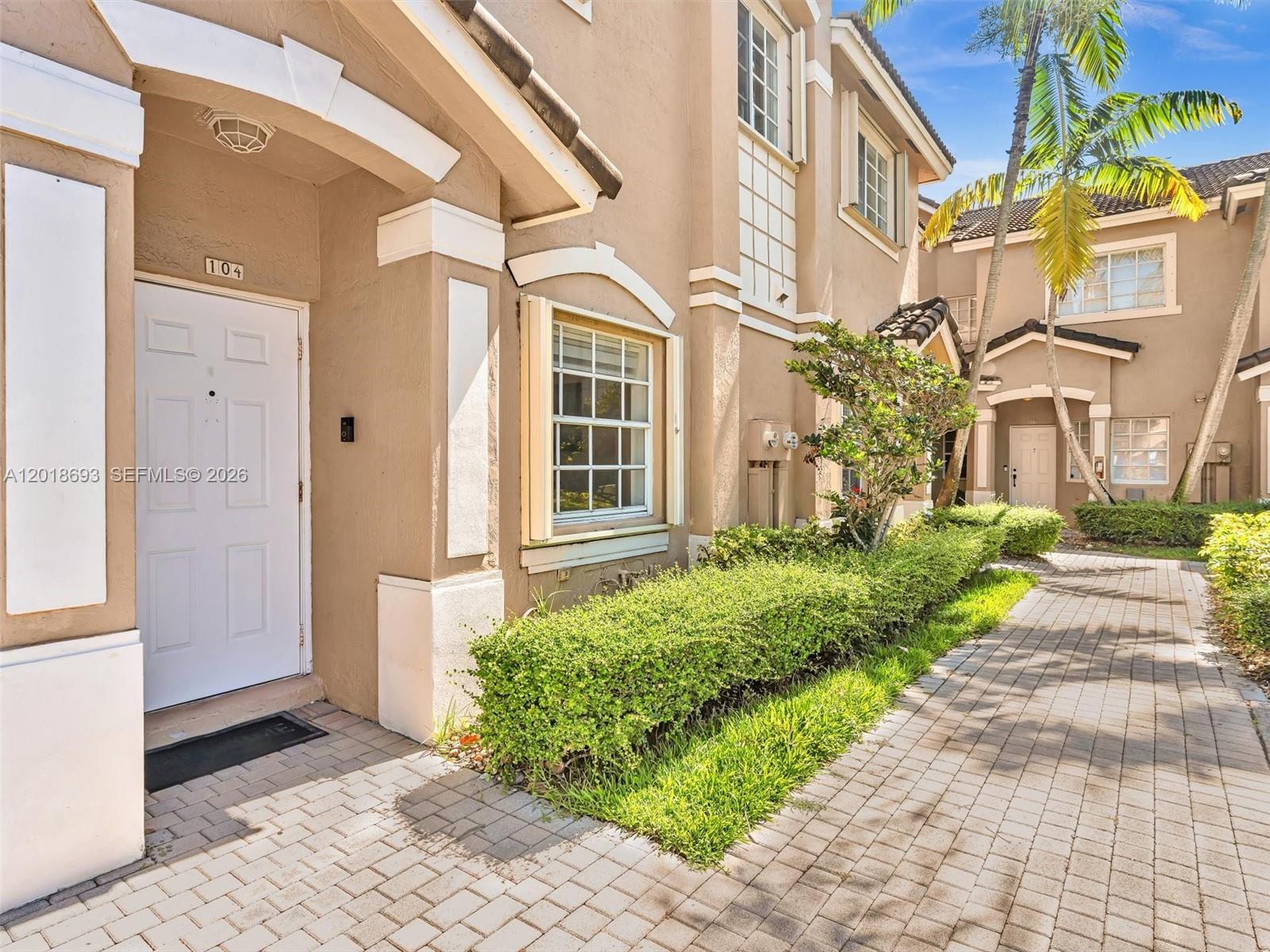Beautifully maintained townhome in gated Las Brisas at Doral.

This well-kept residence offers a practical and functional layout with laminate flooring on the main level and primary bedroom, complemented by durable tile flooring in the two secondary bedrooms for effortless maintenance. The spacious open-concept living and dining areas open directly onto a private back patio featuring tranquil canal views and Doral Meadows Park beyond. With no rear neighbors, the home delivers a rare sense of privacy and openness. Residents enjoy outstanding community amenities including a large swimming pool, modern fitness center, tennis court, children’s playground, and a picturesque canal-side biking and walking trail that encircles the neighborhood. A brand-new roof has just been installed across the entire community, providing excellent long-term value and peace of mind. Located in the desirable 33178 zip code, providing great access to great schools, along with walking trails, dog parks and much more. Diverse dining and major stores including forthcoming Whole Foods, golf courses and much more located minutes away. Close proximity to international airport and major malls. Perfect for those seeking resort-style living with everyday convenience in one of Doral’s most sought-after gated communities.