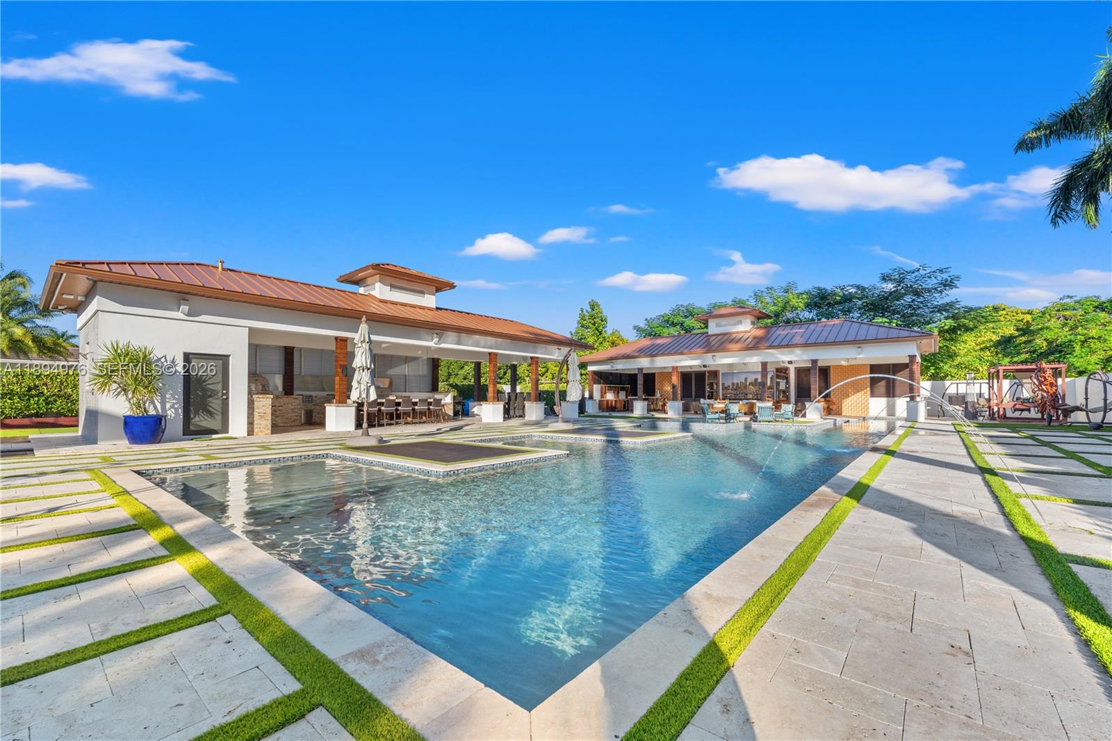 This privately gated JG Heads Farms estate blends style & fun with a sleek modern interior & an incredible outdoor space. The backyard is a dream come true for hosts. Guests can enjoy multiple gazebos complete with a fully equipped kitchen, bar, 4 LED TVs & a full bathroom, or lounge by the Olympic-size pool on tanning beds. A basketball court, putting green, & dedicated pet area add even more versatility. Further enhanced by an EXTENSIVE indoor/outdoor surround sound system & cryo-fog machines, setting the stage for unforgettable gatherings. Indoors, you'll find 4 spacious bedrooms & 4 bathrooms, fully revamped with elegant finishes. The open floor plan creates a seamless flow, perfect for family living. Don’t miss out on this unique estate!