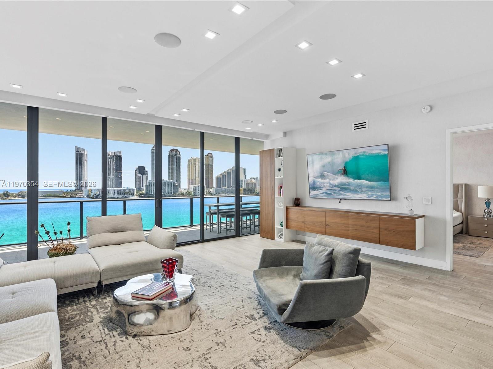 Set within one of South Florida’s most exclusive privately owned island enclaves, residence 606N at Prive presents a rare opportunity to experience truly elevated waterfront living in the heart of Aventura. Positioned within a guard-gated, ultra-private setting accessible only to residents and guests, this expansive residence offers 3 bedrooms, 4 full bathrooms, and 1 half bath across 2,979 square feet of living space. 854 square feet of east-facing terraces complement the interiors, capturing open sky and water views.

The interiors are thoughtfully composed with grand yet intimate living and dining spaces framed by floor-to-ceiling impact glass and seamless indoor-outdoor flow. Natural light pours into every corner, enhancing the residence’s clean architectural lines and generous proportions. The primary suite serves as a private retreat, complete with a spa-inspired bathroom designed for restoration and tranquility, along with expansive walk-in closets that deliver exceptional storage and organization. 

Prive residents enjoy a secured lobby and a comprehensive collection of resort-caliber amenities reserved exclusively for island homeowners. The waterfront pool deck with private café, full-service spa and wellness facilities, tennis and basketball courts, putting green, marina access, and curated recreational spaces create a lifestyle defined by privacy and refinement, all moments from Aventura’s premier shopping, dining, and yachting destinations.